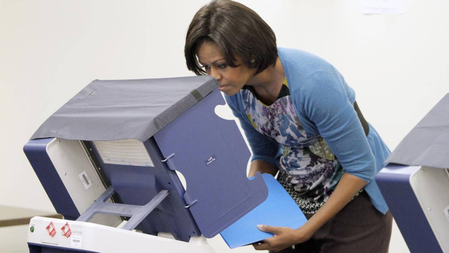 First lady Michelle Obama casts her ballot at an early voting location in Chicago, Oct. 14, 2010. (AP Photo)