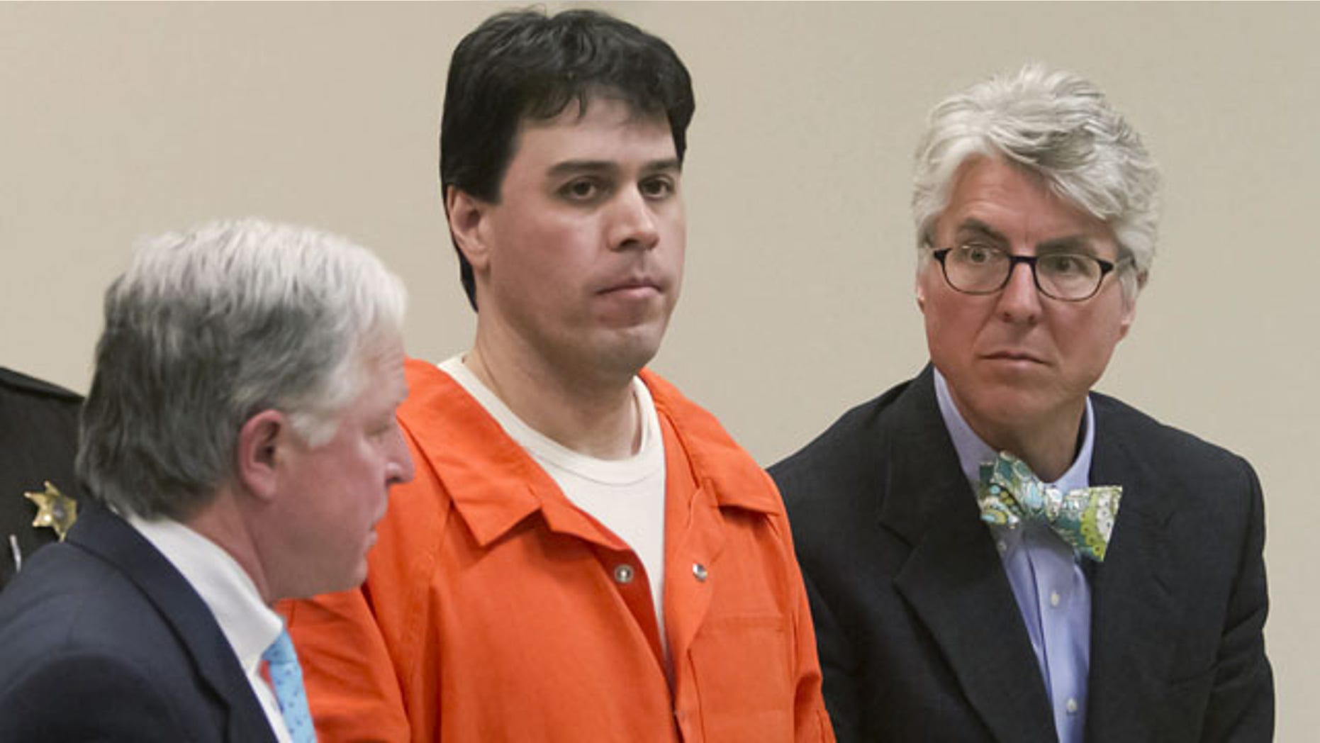 March 3, 2014: Raulie Casteel stands after sentencing in Livingston County, flanked by his attorneys Douglas Mullkoff, at left, and Charles Groh, in Howell, Mich. Casteel was sentenced to 18 to 40 years in prison on a combination of terrorism and weapons convictions. (AP Photo/Livingston County Daily Press & Argus, Gillis Benedict, Pool)