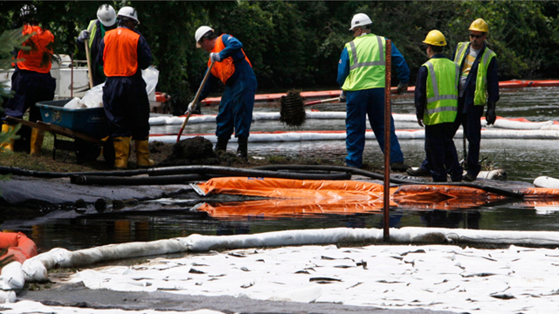 Cleanup crews in Marshall Township, Michigan in 2010.