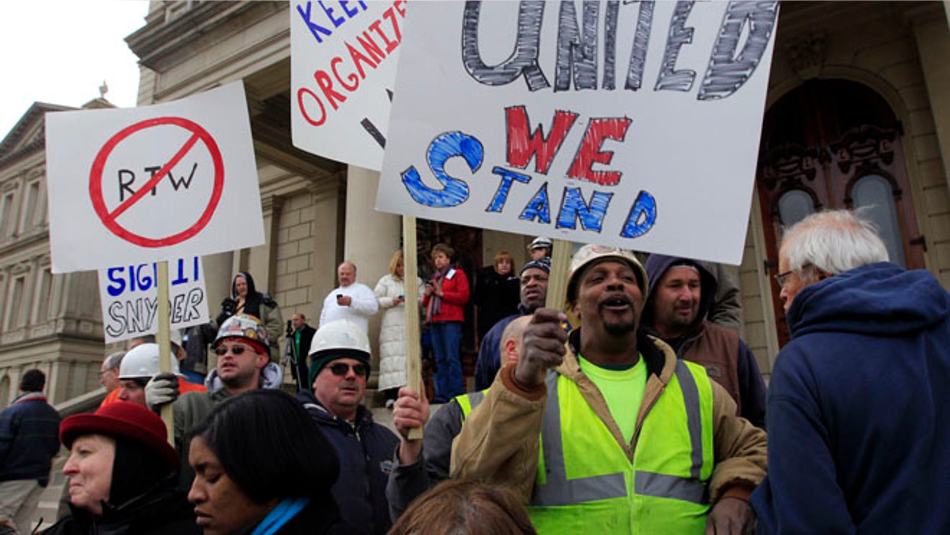 Dec. 6, 2012: Union workers rally outside the Capitol in Lansing, Mich., as Senate Republicans introduced right-to-work legislation in the waning days of the legislative session.