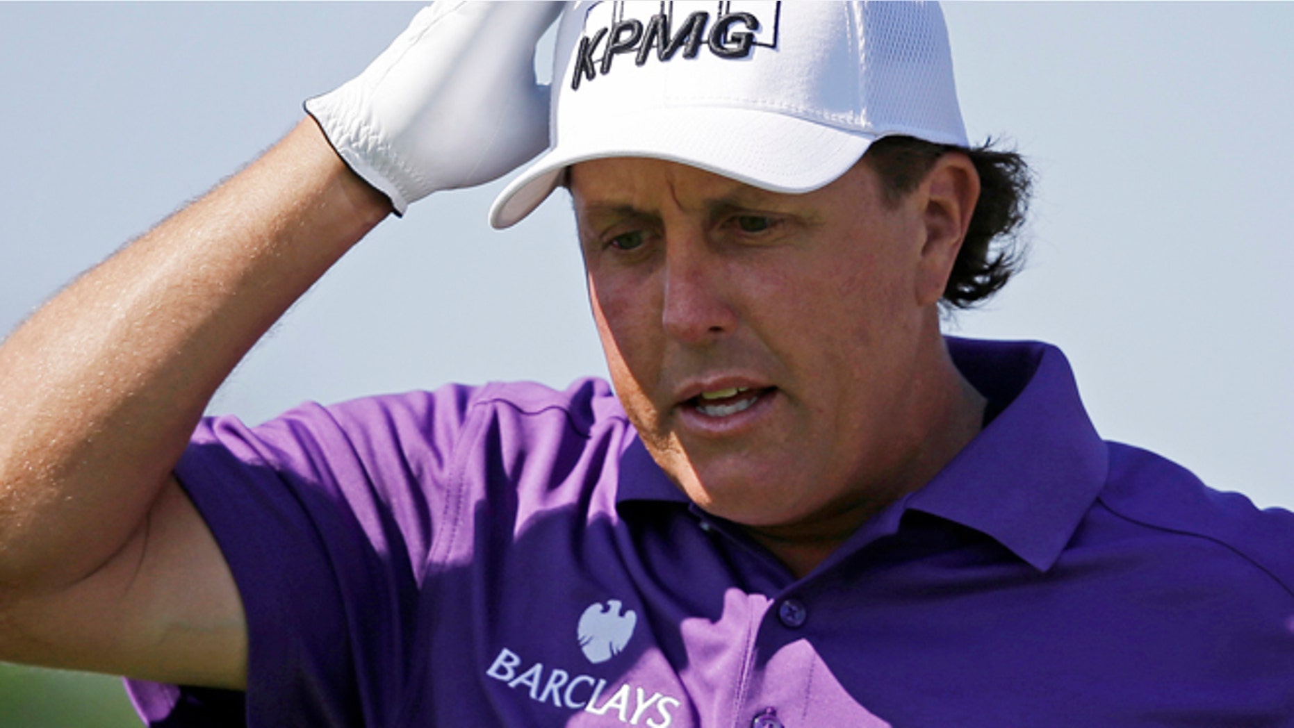 May 31: Phil Mickelson adjust his hat as he walks off the first tee during the third round of the Memorial golf tournament Dublin, Ohio.