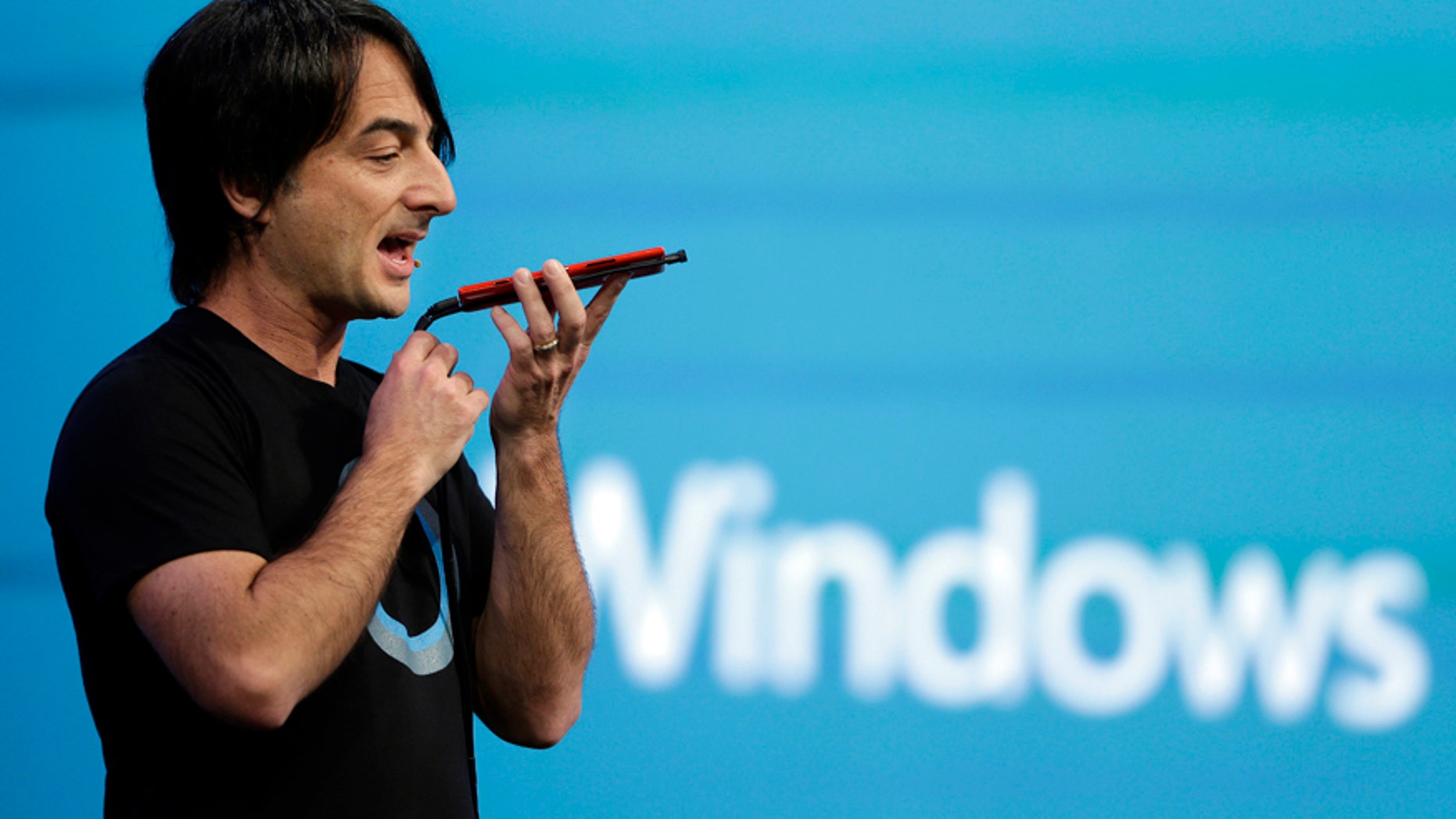 Microsoft corporate vice president Joe Belfiore, of the Operating Systems Group, demonstrates the new Cortana personal assistant during the keynote address of the Build Conference Wednesday, April 2, 2014, in San Francisco.