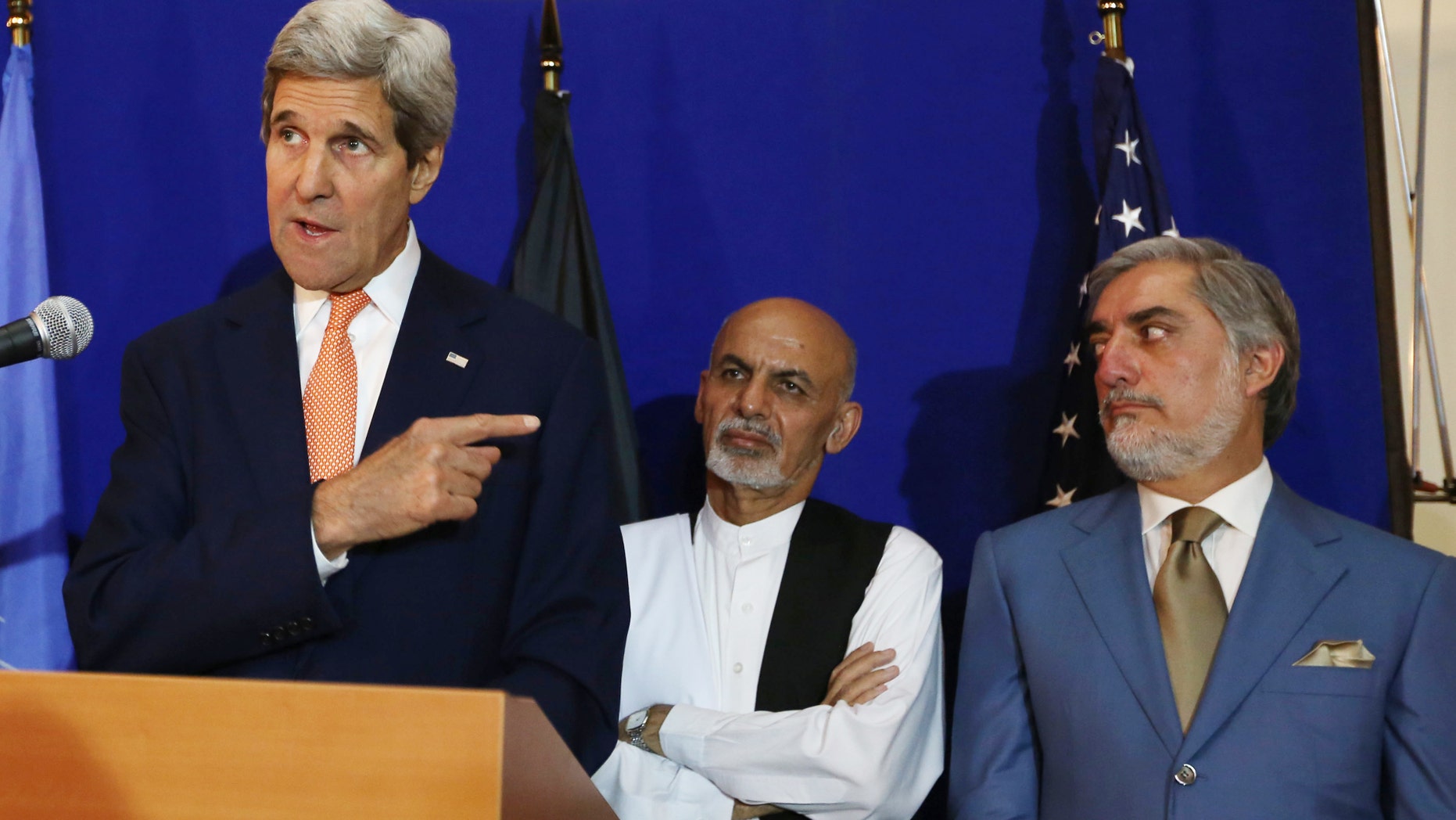 Aug. 8, 2014 - FILE photo of Secretary of State John Kerry, left, speaking as Afghan presidential candidates Ashraf Ghani Ahmadzai, center, and Abdullah Abdullah listen during a press conference in Kabul, Afghanistan. Abdullah said Monday he will not accept the expected outcome of the election's 2nd round and talks with Ahmadzai to form a national unity government are deadlocked.