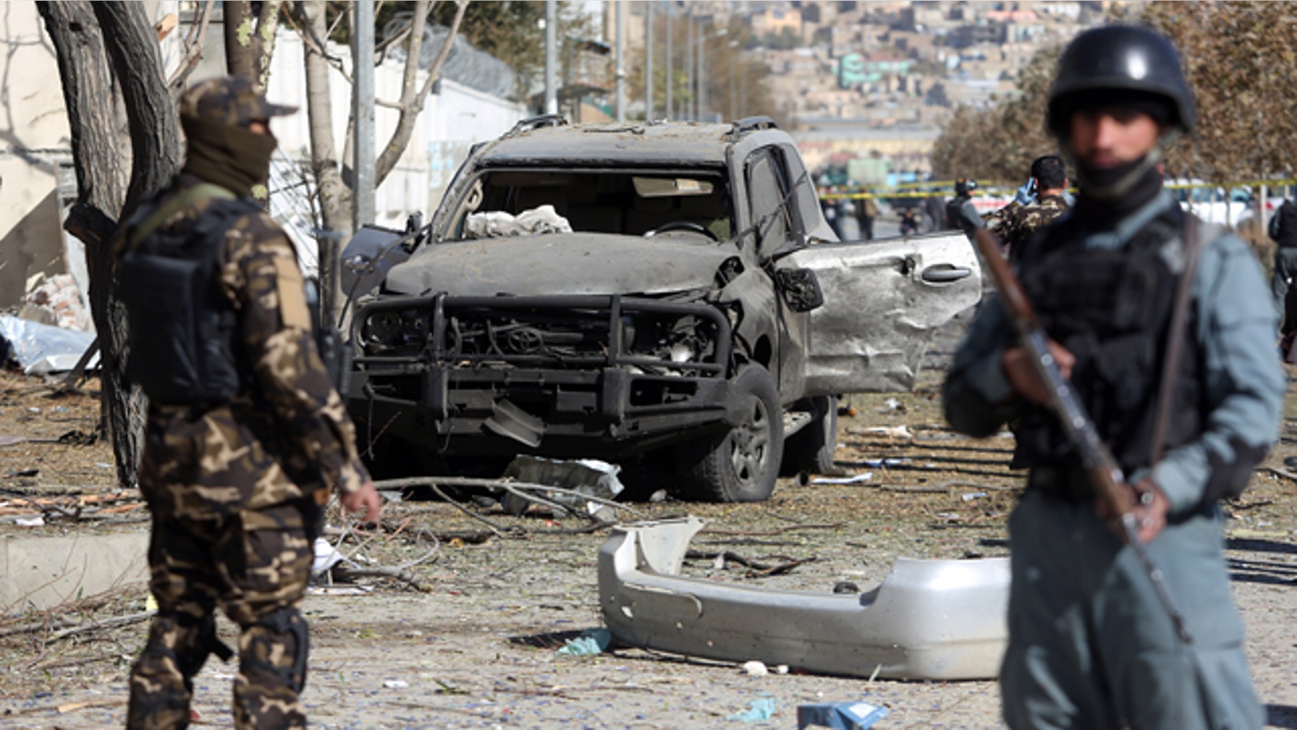 November 16, 2014: Afghan security forces inspect the site of a suicide attack in Kabul. A suicide bomber tried to assassinate a prominent female member of Afghanistan's parliament on Sunday, killing three people and wounding the lawmaker, a senior official said. (AP Photo/Rahmat Gul)