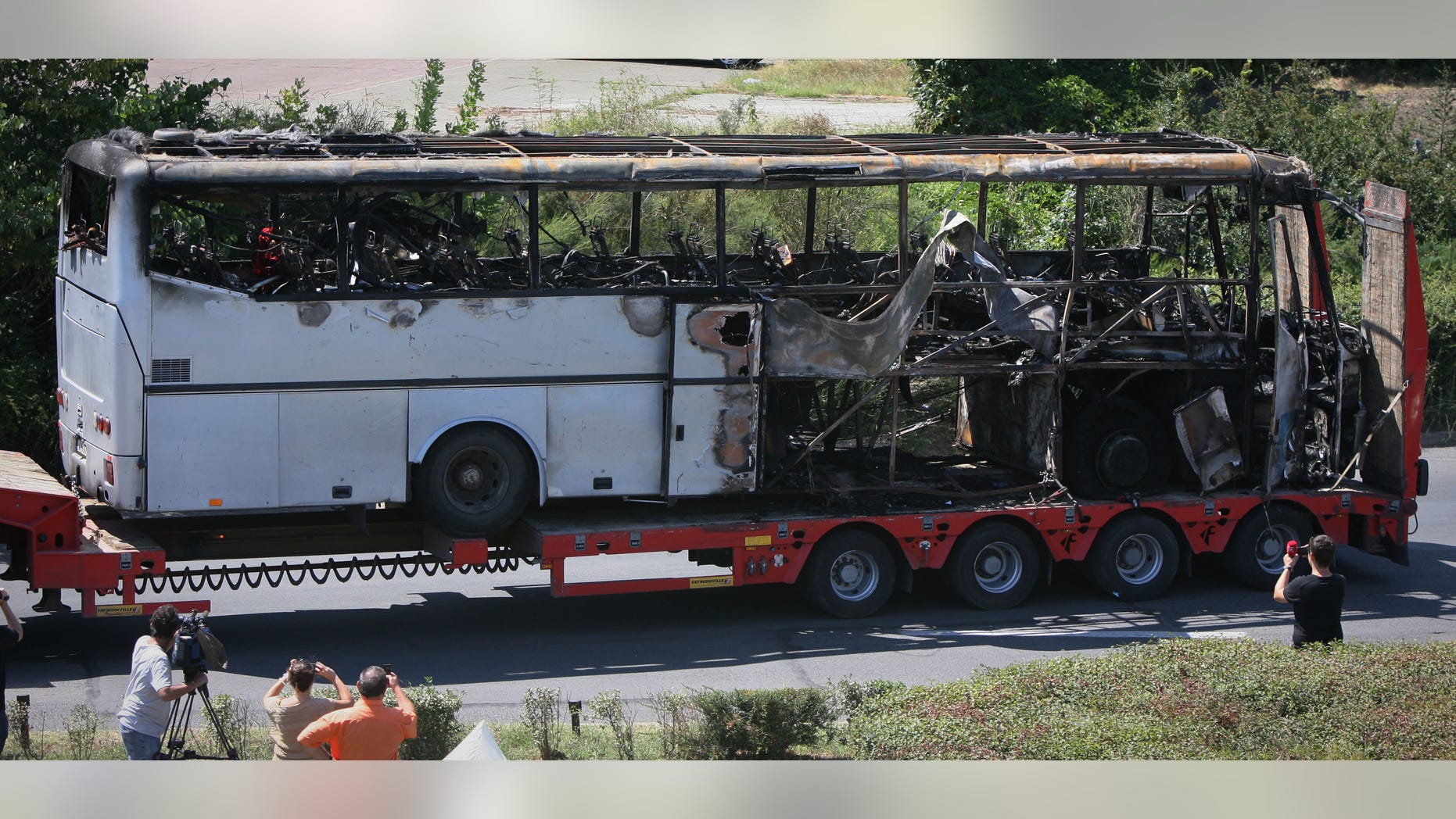 July 19, 2012 in this file photo, a damaged bus is transported out of Burgas airport, Bulgaria, a day after a deadly suicide attack on a bus full of Israeli vacationers.