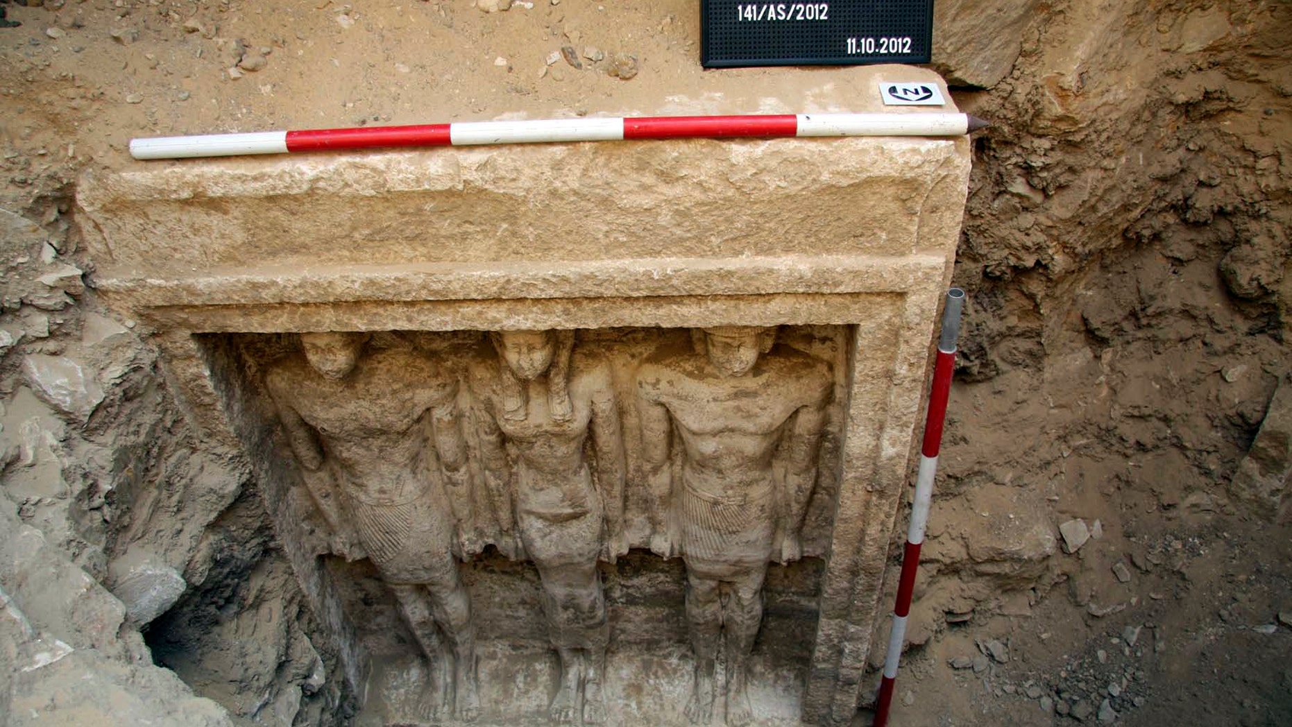 Oct. 11, 2012: This photo released Friday, Nov. 2, 2012 by Egypt's Supreme Council of Antiquities, shows recently discovered statues of two men and a woman in a complex of tombs, including one of a pharaonic princess, in the Abusir region, south of Cairo, Egypt.