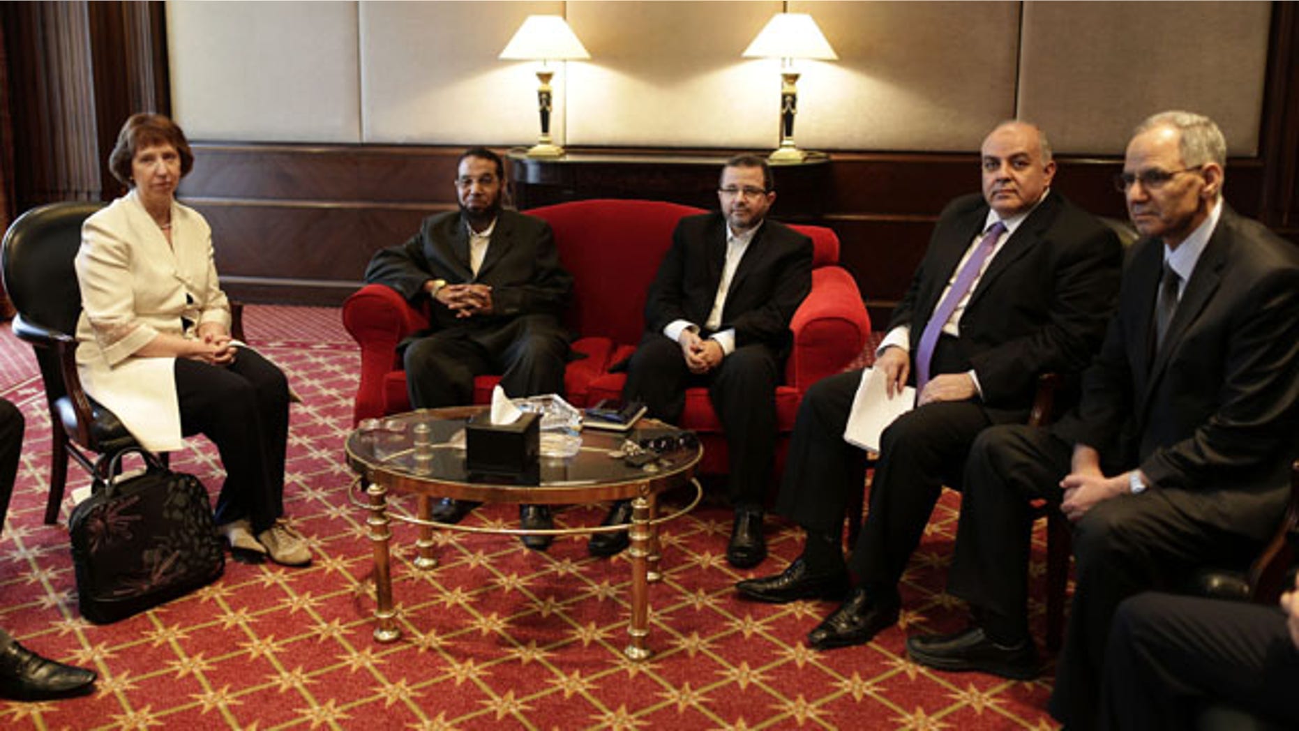 July 29, 2013: European Union foreign policy chief Catherine Ashton, left, meets with Mahmoud Taha, a leader in the Construction and Development Party, the political wing of the former Gamaa Islamiya militant group, second left, Hesham Kandil, former Egyptian Prime Minister, center, Amr Darrag, a member of the Muslim Brotherhood's Freedom and Justice Party, second right, Mohammed Ali Bishr, a member of the Muslim Brotherhood’s leadership council, right, in Cairo. (AP Photo)
