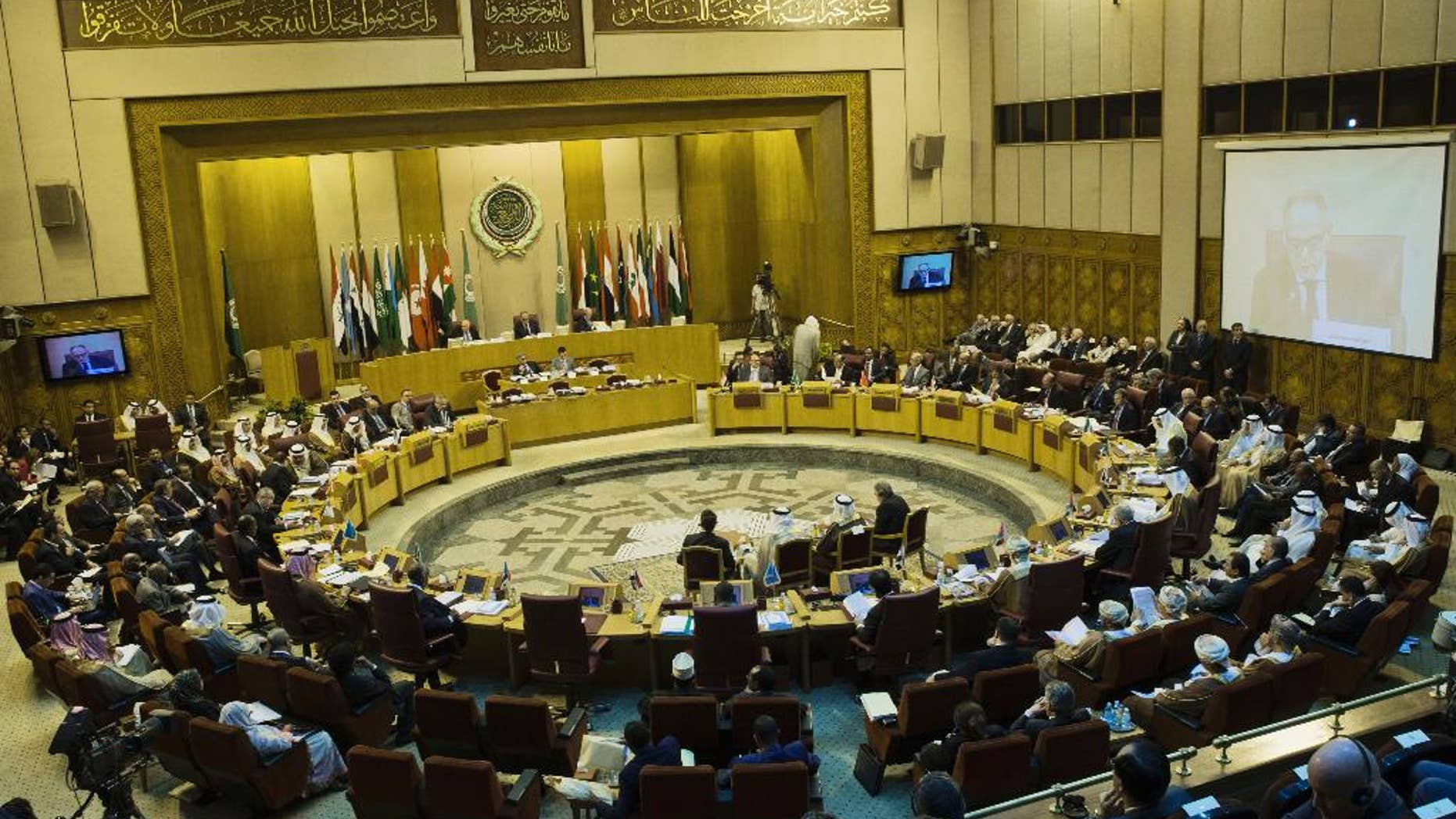 Arab foreign ministers take their seats for their meeting at the Arab League headquarters in Cairo, Egypt, Sunday, Sept. 7, 2014. Abbas, who has threatened to dissolve a new unity government if the Hamas militant group does not yield power in the Gaza Strip, attended the meeting in Cairo on Sunday. (AP Photo/Hassan Ammar)