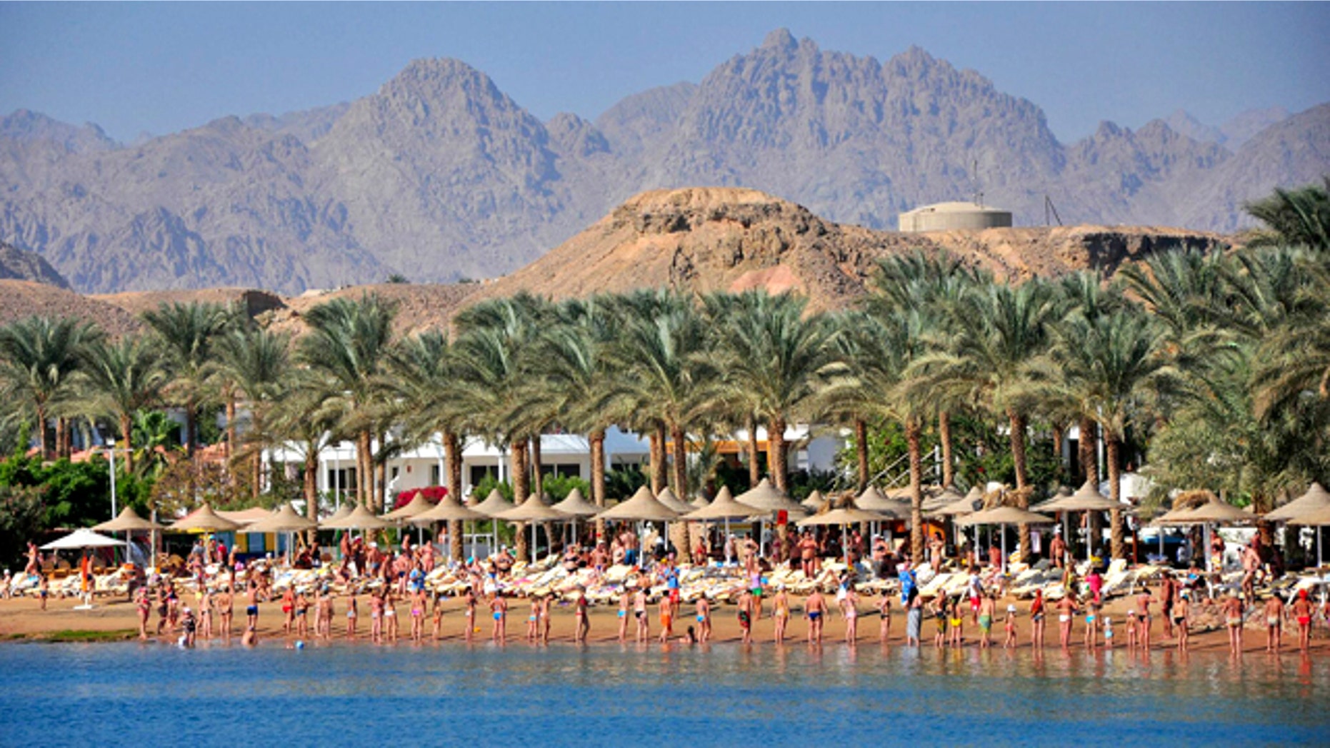 Tourists who were due to participate in an aquatic exercise class perform on the sand instead, at the Egyptian Red Sea resort of Sharm el-Sheikh, Egypt, Monday, Dec. 6, 2010. Egyptian authorities have indefinitely closed the resort's beaches for swimming after oceanic white tip sharks mauled three Russians and a Ukrainian tourist last week, and tore the arm off an elderly German tourist on Sunday, killing her almost immediately.