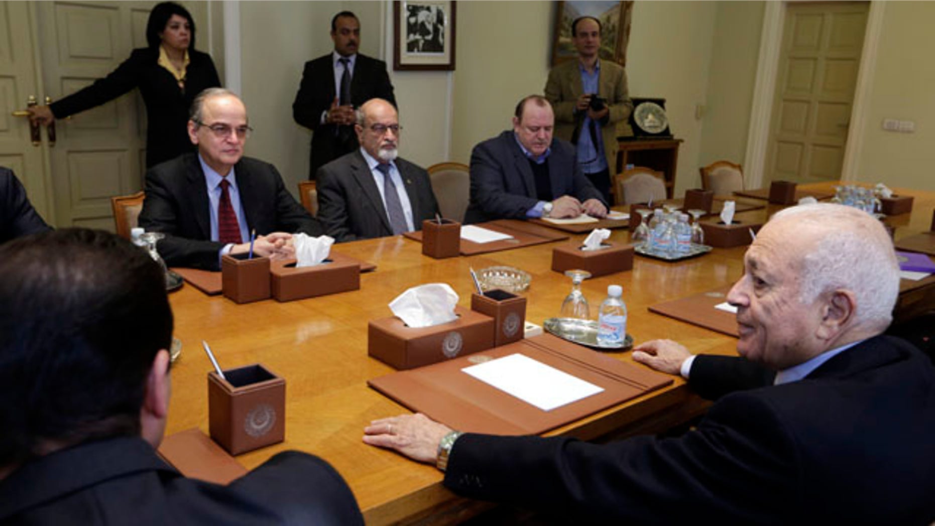 Dec. 27, 2014: The Arab League's Secretary-General Nabil Elaraby, right, meets with Hadi Bahra, the head of the Syrian National Coalition, the country's main political opposition group, left, and Haitham al-Maleh, a member of the group, second left, at the league's headquarters in Cairo. (AP Photo/Amr Nabil)
