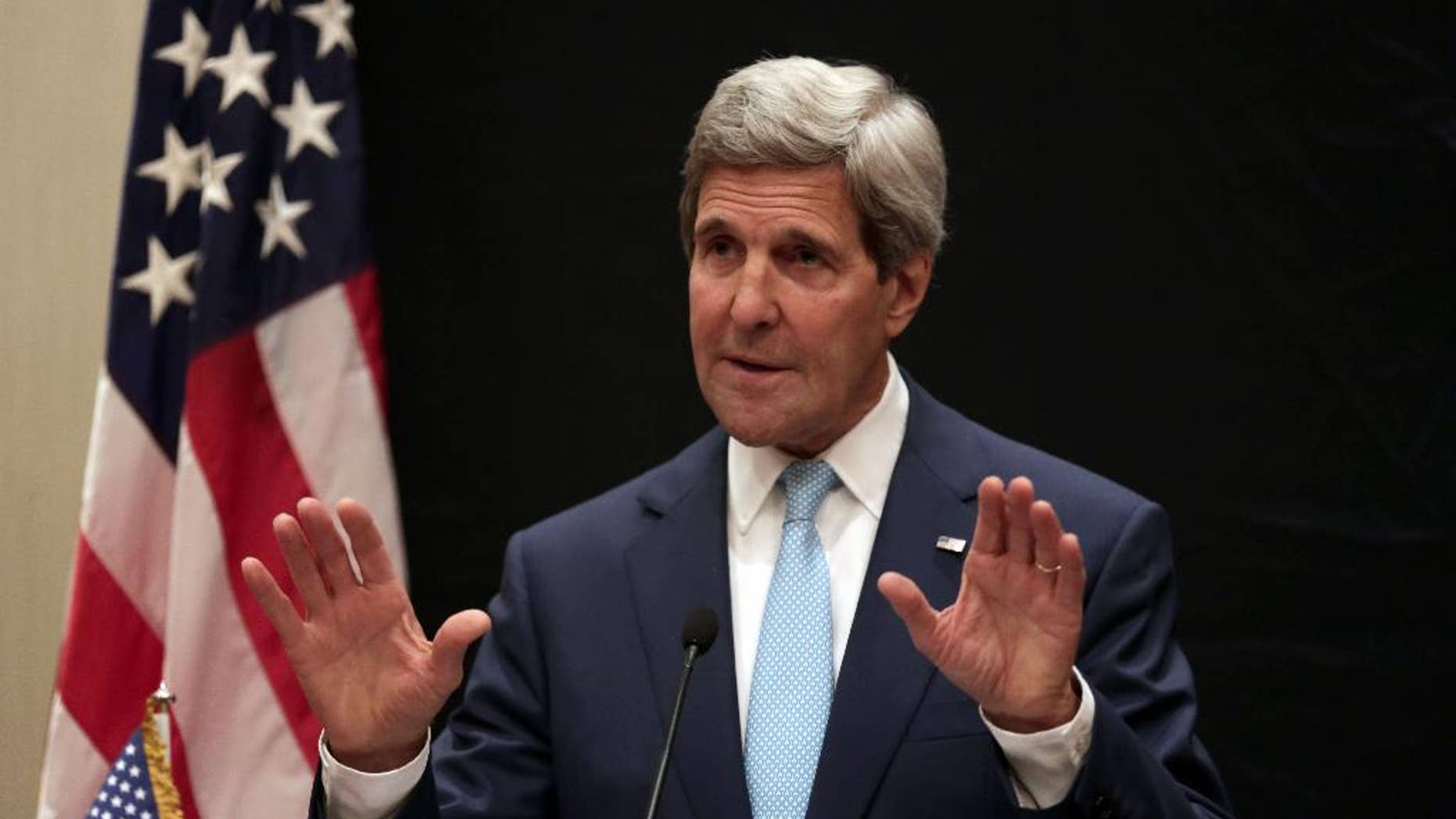U.S. Secretary of State John Kerry speaks during a joint news conference with Egyptian Foreign Minister Sameh Shoukry following his meeting with Egyptian President Abdel-Fattah el-Sissi, Sunday, June 22, 2014, in Cairo, Egypt. (AP Photo/Maya Alleruzzo)
