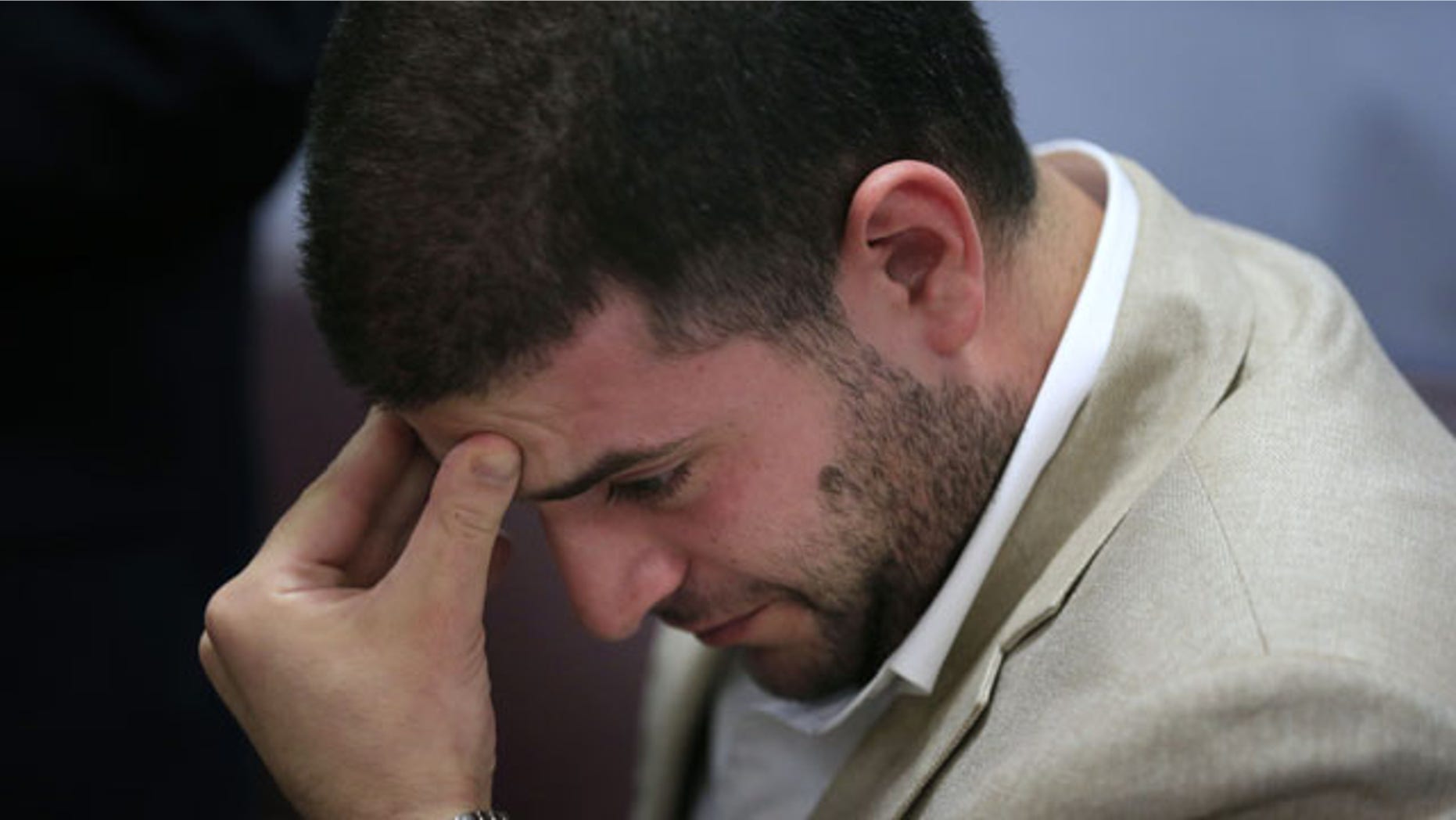 July 22, 2013: Osama Morsi, son of ousted Egyptian President Mohammed Morsi reacts during a press conference in Cairo