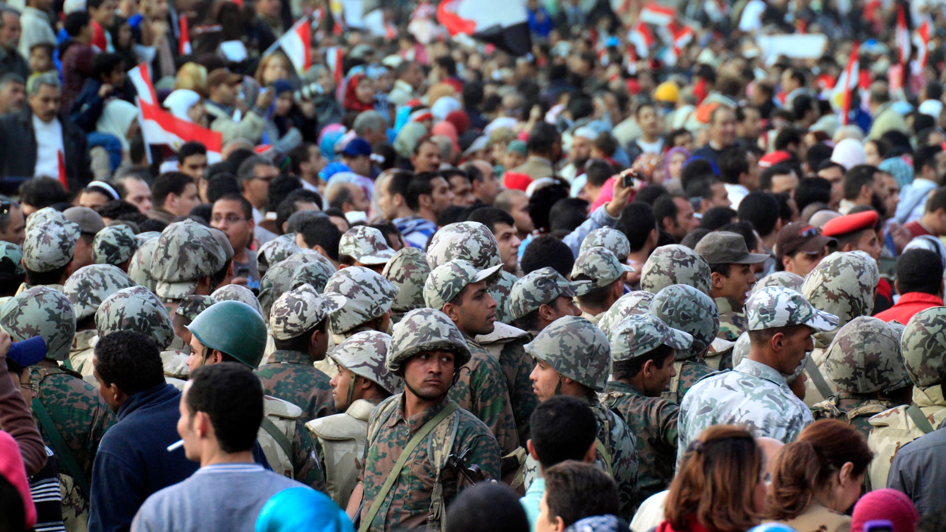 Feb. 12: Egyptian army soldiers surround an entrance to Tahrir Square, Egypt. The main coalition of youth and opposition groups says it will end its protest in a central Cairo square after they succeeded in ousting longtime authoritarian leader Hosni Mubarak. But the groups say they will call for weekly demonstrations to maintain pressure on the ruling military to implement democratic reforms. (AP)