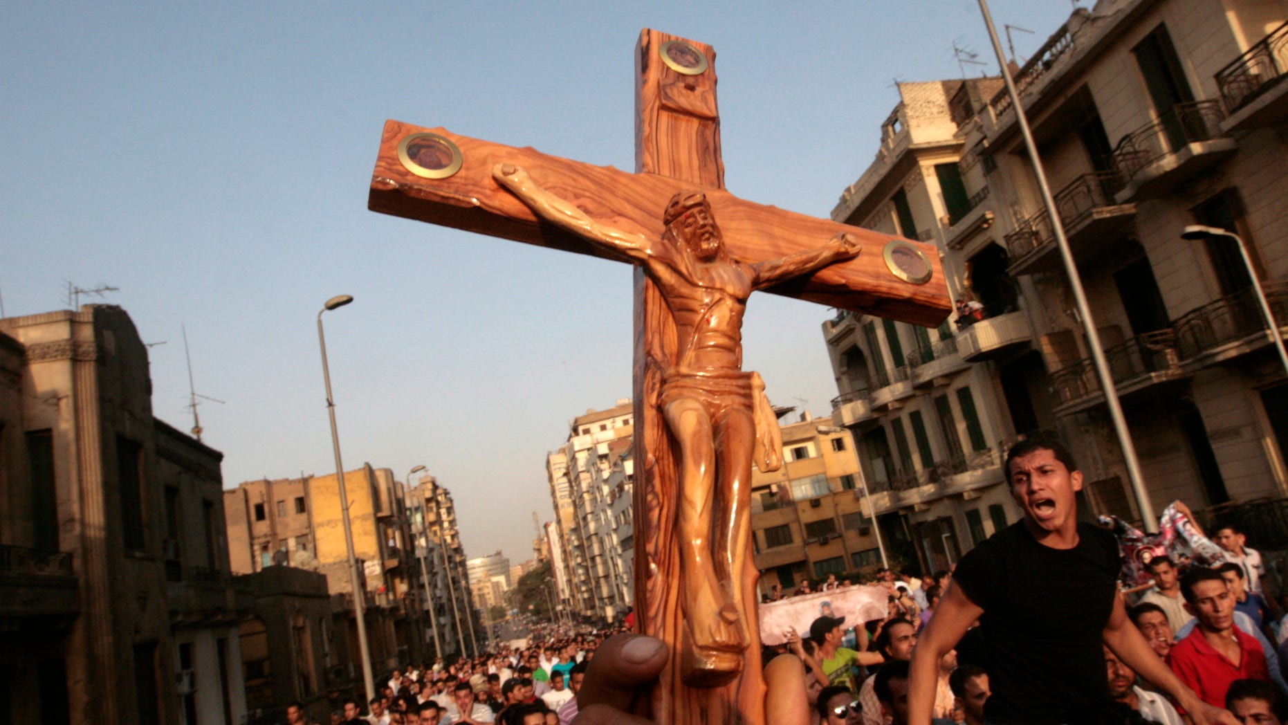 Angry Egyptian Christians protest outside St. Mark's Cathedral against the military ruling council in Cairo Egypt, Monday, Oct. 10, 2011 a day after at least 24 people were killed when Christians, angered by a recent church attack, clashed Sunday night with Muslims and security forces outside the state television building in central Cairo.