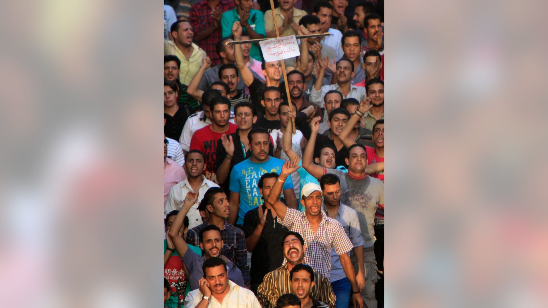Angry Egyptian Christians protest against the military ruling council in Cairo Egypt, Monday, Oct. 10, 2011 a day after at least 24 people were killed when Christians, angered by a recent church attack, clashed Sunday night with Muslims and security forces outside the state television building in central Cairo.