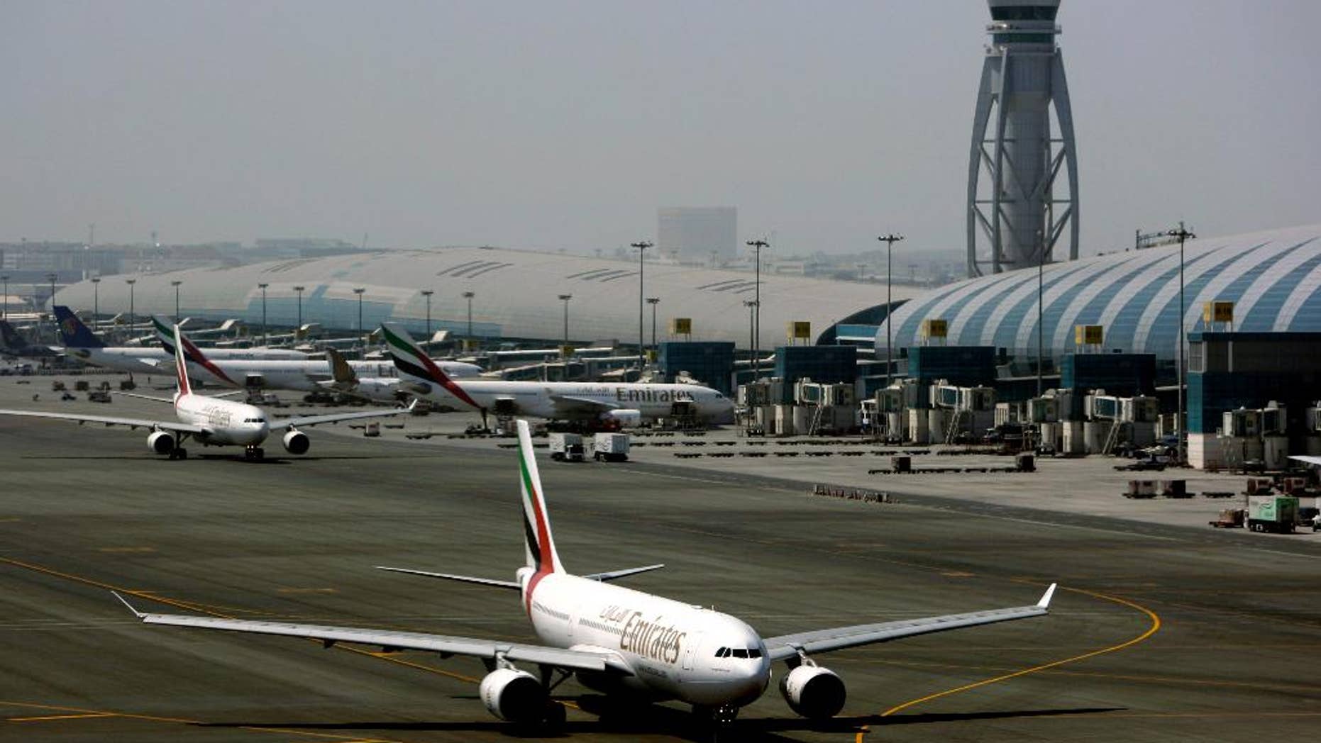 FILE - In Tuesday April 20, 2010 file photo, an Emirates airline passenger jet taxis on the tarmac at Dubai International airport in Dubai, United Arab Emirates. Officials say the Mideast’s busiest airport in Dubai will undergo a major runway overhaul starting next month that will see more than a dozen airlines shift flights to another airport in the city. (AP Photo/Kamran Jebreili, File)