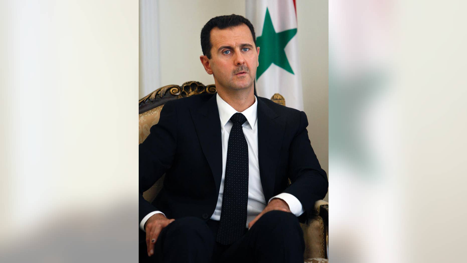 FILE - This Wednesday, Aug. 19, 2009 file photo shows Syrian President Bashar Assad during a meeting with his Iranian counterpart Mahmoud Ahmadinejad at the presidency in Tehran, Iran. In excerpts of an interview with Czech publication Literarni Noviny, published by Syria's state media Wednesday, Jan. 14, 2015, Assad says Syria is against the killing of civilians anywhere in the world and sympathizes with the families of victims of last week's terrorist attack in France. Assad also called on Western politicians to reconsider their backing of Syrian rebels and opposition. (AP Photo/Vahid Salemi, File)