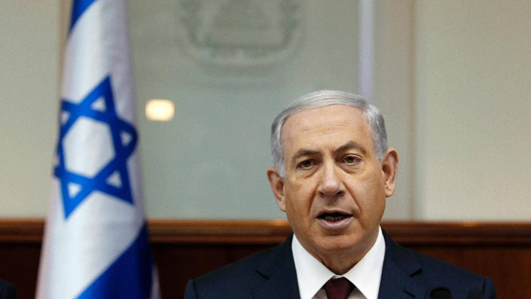 Israel's Prime Minister Benjamin Netanyahu chairs the weekly cabinet meeting in Jerusalem, Sunday, Nov. 2, 2014. Jerusalem, at the center of the Israeli-Palestinian conflict, has been edging toward a new conflagration, with politicians on both sides stoking religious fervor over an ancient Jerusalem shrine sacred to Muslims and Jews. After months of escalating violence, Netanyahu on Sunday made his clearest attempt yet to cool tempers, saying he won’t allow changes to a long-standing ban on Jewish worship at the Muslim-run site, despite such demands from ultra-nationalists in his coalition. (AP Photo/Ronen Zvulun, Pool)