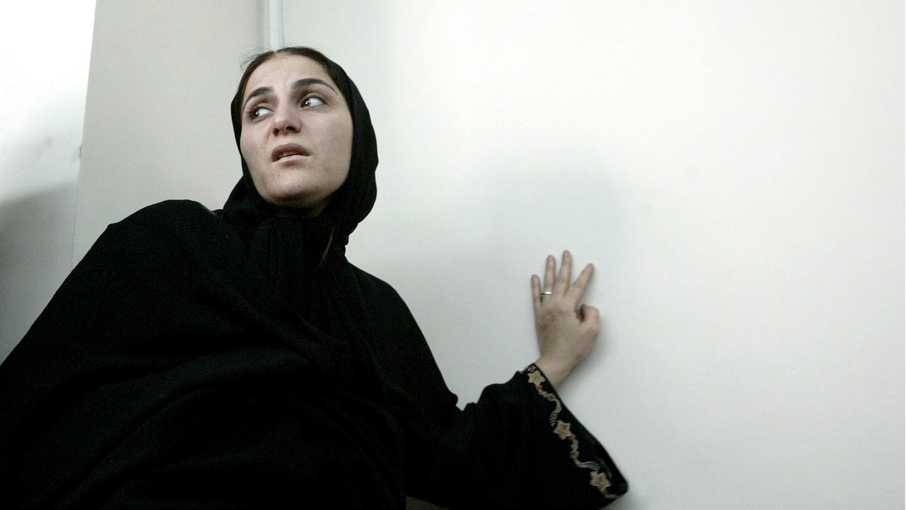 In this photo taken on June 7, 2004, Shahla Jahed, enters the court room for her trial, in Tehran, Iran. Iran on Wednesday, Dec. 1, 2010, hanged a former soccer player's mistress _ known as a "temporary wife" _ who was convicted of murdering her love rival, the player's wife, the official IRNA news agency reported. Shahla Jahed was hanged at dawn, after spending more than eight years in jail, IRNA said, in a case that has captivated the Iranian public for several years.