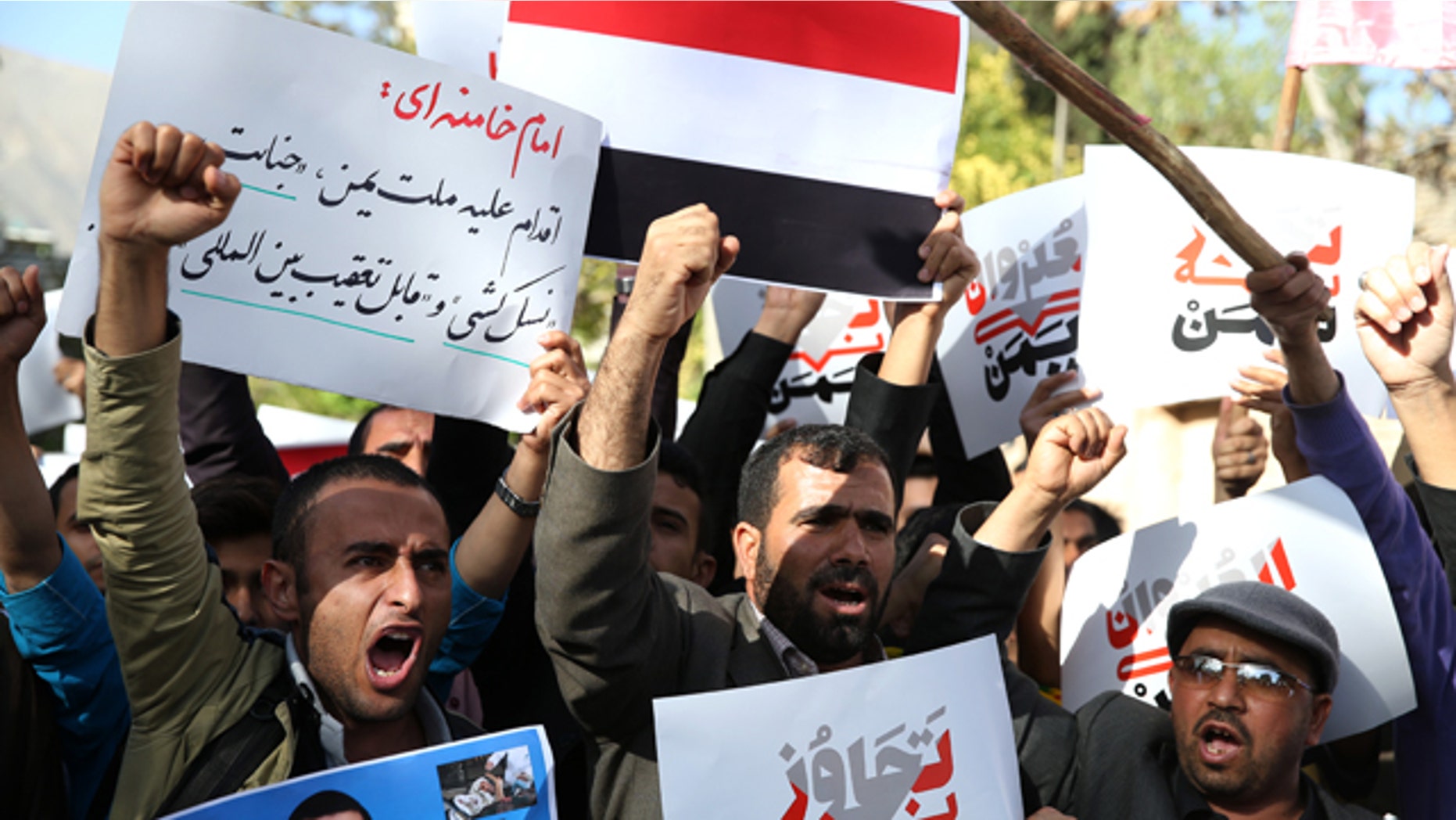 April 13, 2015: Yemeni expatriates and Iranians chant slogans during a protest against the Saudi-led coalition strikes on Yemen, in front of the Saudi Embassy in Tehran. (AP Photo/Ebrahim Noroozi)