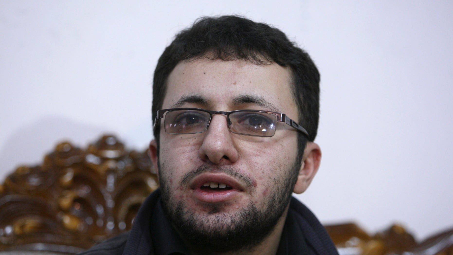 Iranian Sajjad Qaderzadeh, whose mother, Sakineh Mohammadi Ashtiani, has been sentenced to death by stoning for adultery, speaks with the media in a news briefing in the northwestern city of Tabriz, Iran, Saturday, Jan. 1, 2011. Ashtiani's sentence of death by stoning, which Iran has put on hold, has brought harsh condemnation from the U.S., the European Union and rights groups who are demanding Tehran stay the execution. It has further strained Iran's relations with world powers, already tense over the country's disputed nuclear program.