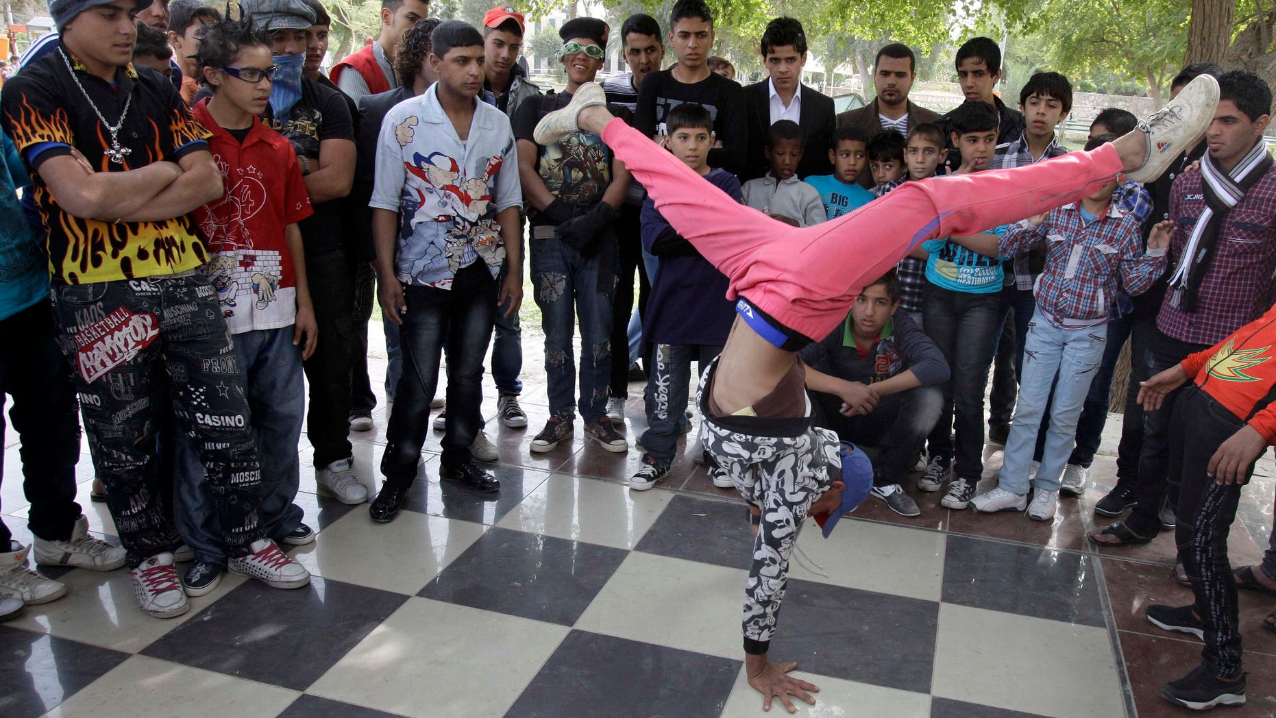 Nov. 10, 2011: An Iraqi boy dances to hip hop music in Baghdad, Iraq. After more than eight years in Iraq, the departing American military's legacy includes a fledgling democracy, bitter memories of war, and for the nation's youth, rap music, tattoos and slang.