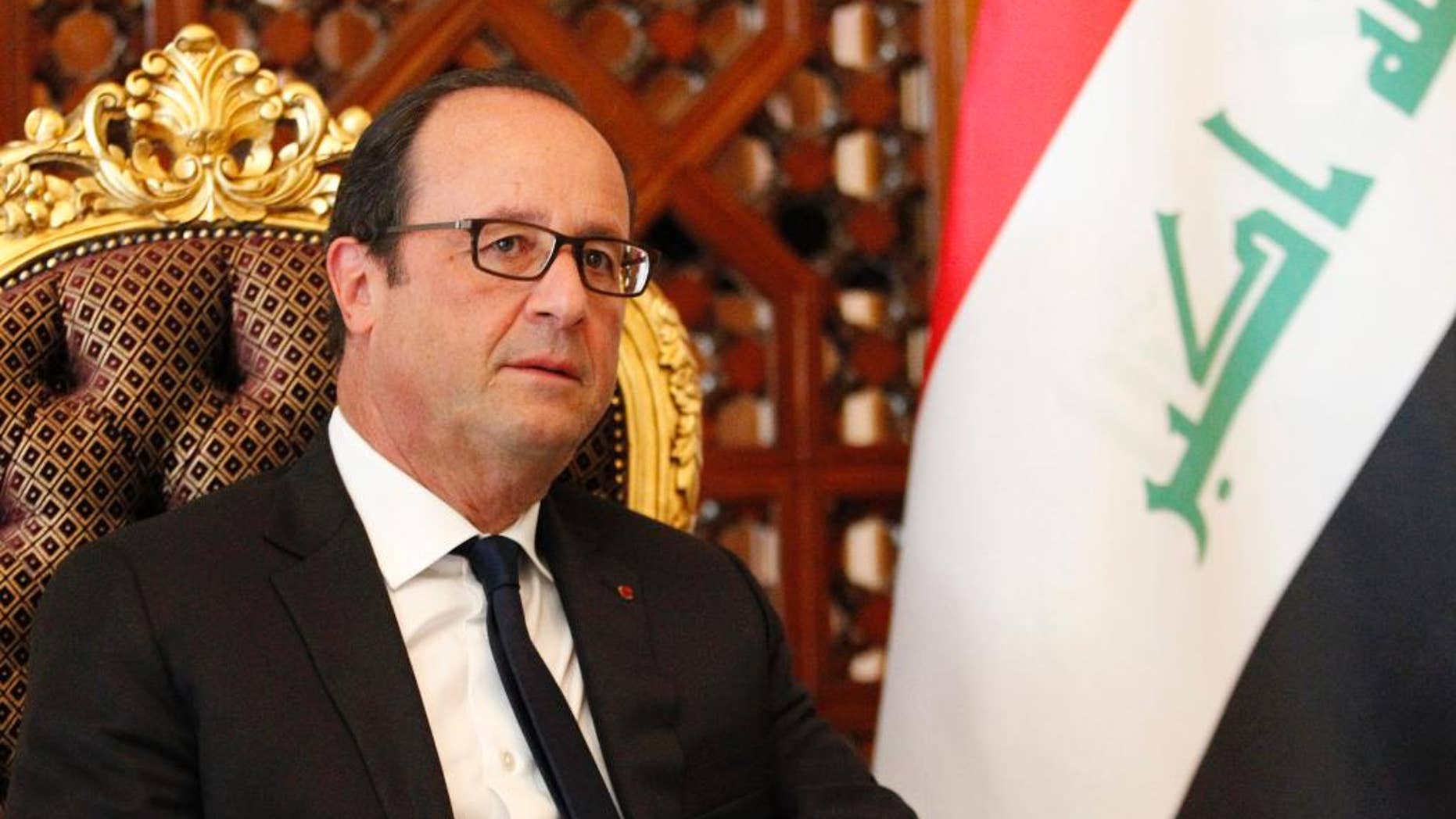 French President Francois Hollande is seen after his arrival at Baghdad Airport in Baghdad, Iraq, Friday, Sept. 12, 2014. Hollande expressed his solidarity with Iraq on a visit to Baghdad on Friday, as his country prepares for possible airstrikes with a U.S.-led coalition against extremists who have seized territory around the region. (AP Photo/Thaier Al-Sudani, Pool)