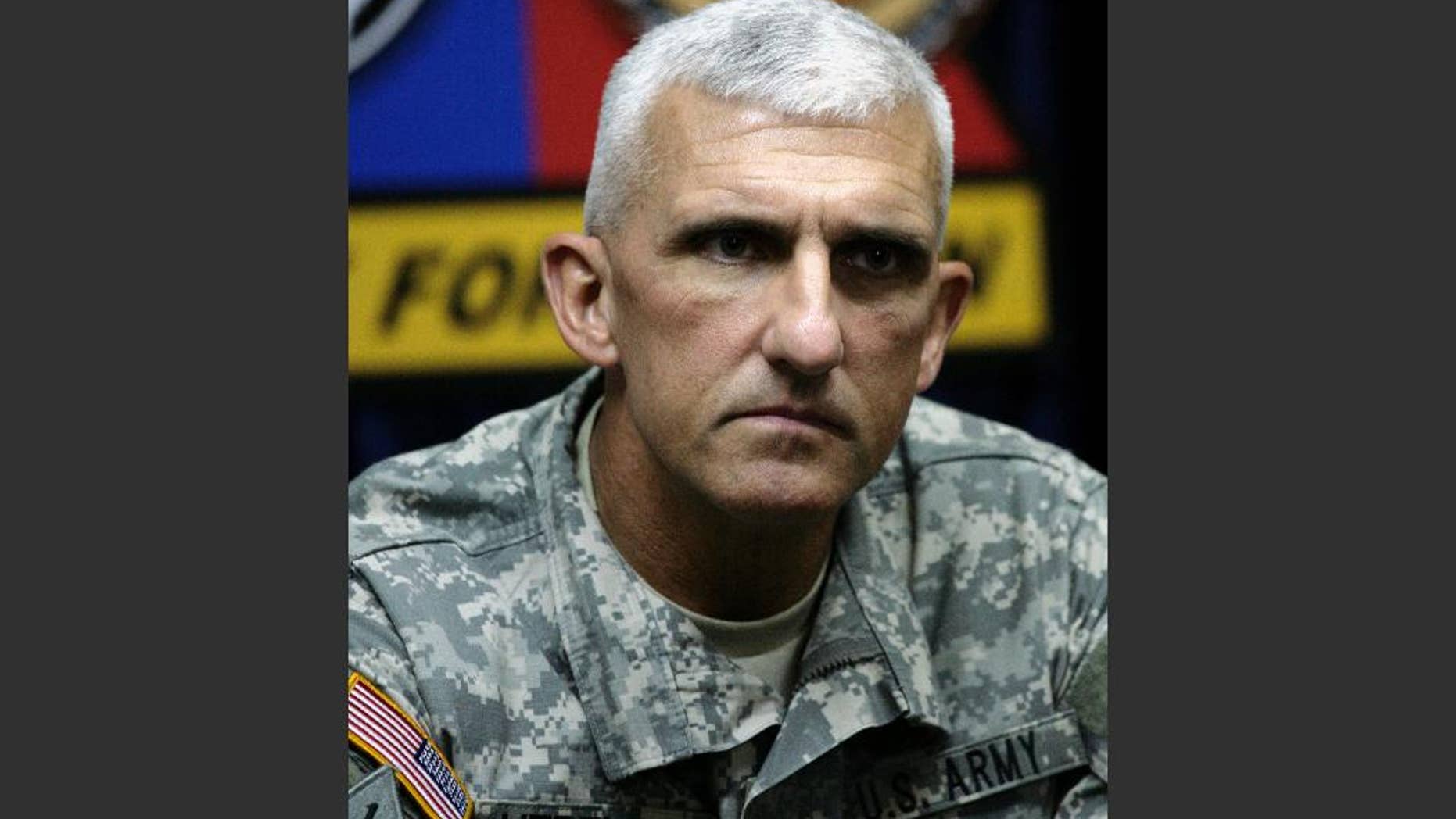 FILE - In this file photo taken on Oct. 28, 2007, then Maj. Gen. Mark P. Hertling, commander of the 1st Armored Division, talks to reporters in Tikrit, Iraq. The former top U.S. commander in northern Iraq on Thursday, June 12, 2014, defended the multibillion dollar American effort to train Iraqi security forces despite this week’s Sunni insurgent offensive that has seen two key cities occupied as soldiers and police abandoned their posts. (AP Photo/Maya Alleruzzo, Pool, File)