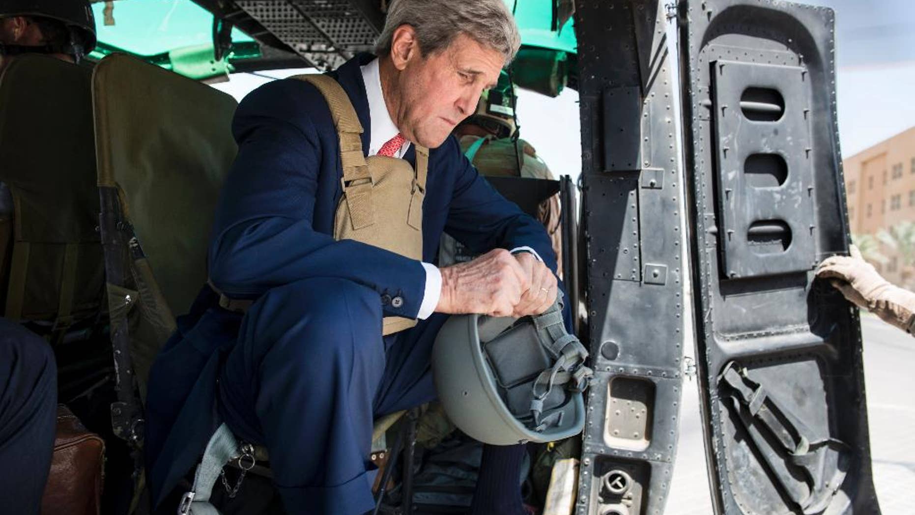 Sept. 10, 2014: U.S. Secretary of State John Kerry arrives in Baghdad, Iraq. Kerry is traveling to the mideast this week to discuss ways to bolster the stability of the new Iraqi government and combat the Islamic State militant group that has taken over large swaths of Iraq and Syria.