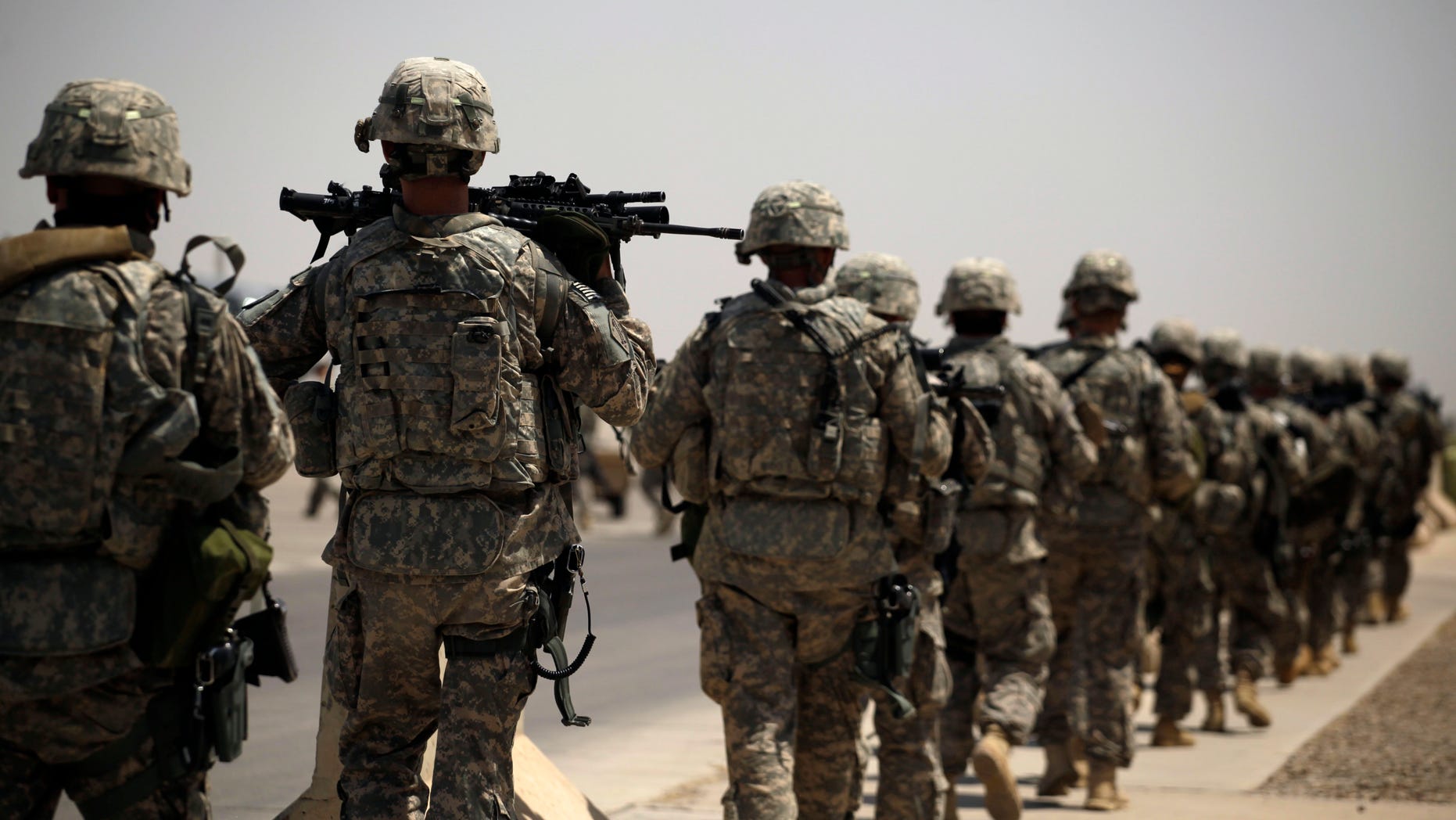 Aug. 2, 2011: U.S. Army soldiers make their way to a C-130 aircraft at Sather Air Base in Baghdad, Iraq to begin their journey home to the United States.