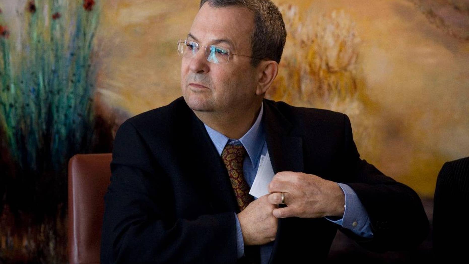 FILE - In this Monday Jan. 17, 2011 file photo, Former Israeli Defense Minister Ehud Barak attends a press conference at the Knesset, Israel's parliament, in Jerusalem. Former Defense Minister Ehud Barak’s comments that Israel came close to ordering an attack on Iran’s nuclear facilities but was thwarted by military men and cowardly politicians could shake up Israeli politics. The leaked interview, in which Barak also described Prime Minister Benjamin Netanyahu as indecisive and obsessively pessimistic, was the talk of the town Sunday in an Israel obsessed about Iran. (AP Photo/Bernat Armangue, File)