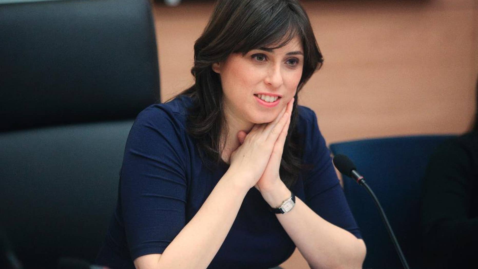 In this photo taken March 13, 2012, Knesset member Tzipi Hotovely sits in the Knesset, Israel's parliament, in Jerusalem. on Thursday, May 21, 2015 Hotovely, Israel’s new deputy foreign minister, delivered a defiant message to the international community on Thursday, May 21, 2015, saying that Israel owes no apologies for its policies in the Holy Land and citing religious texts that it belongs to the Jewish people. (AP Photo/Emil Salman)