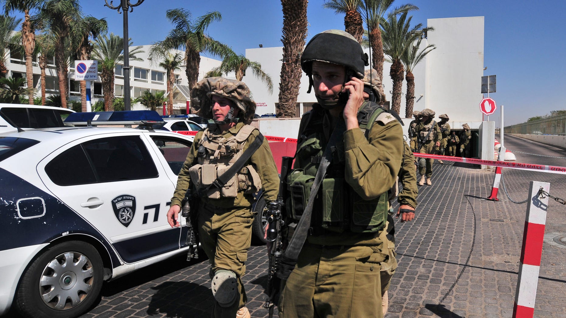 Israeli soldiers secure the area near the site of a shooting incident at a hotel in the Red Sea resort town of Eilat, Israel, Friday, Oct. 5, 2012. A young American opened fire in a hotel in Eilat Friday, killing one person before police shot him dead in an incident that appeared to be a personal dispute. (AP Photo/Eliraz Getah) ISRAEL OUT