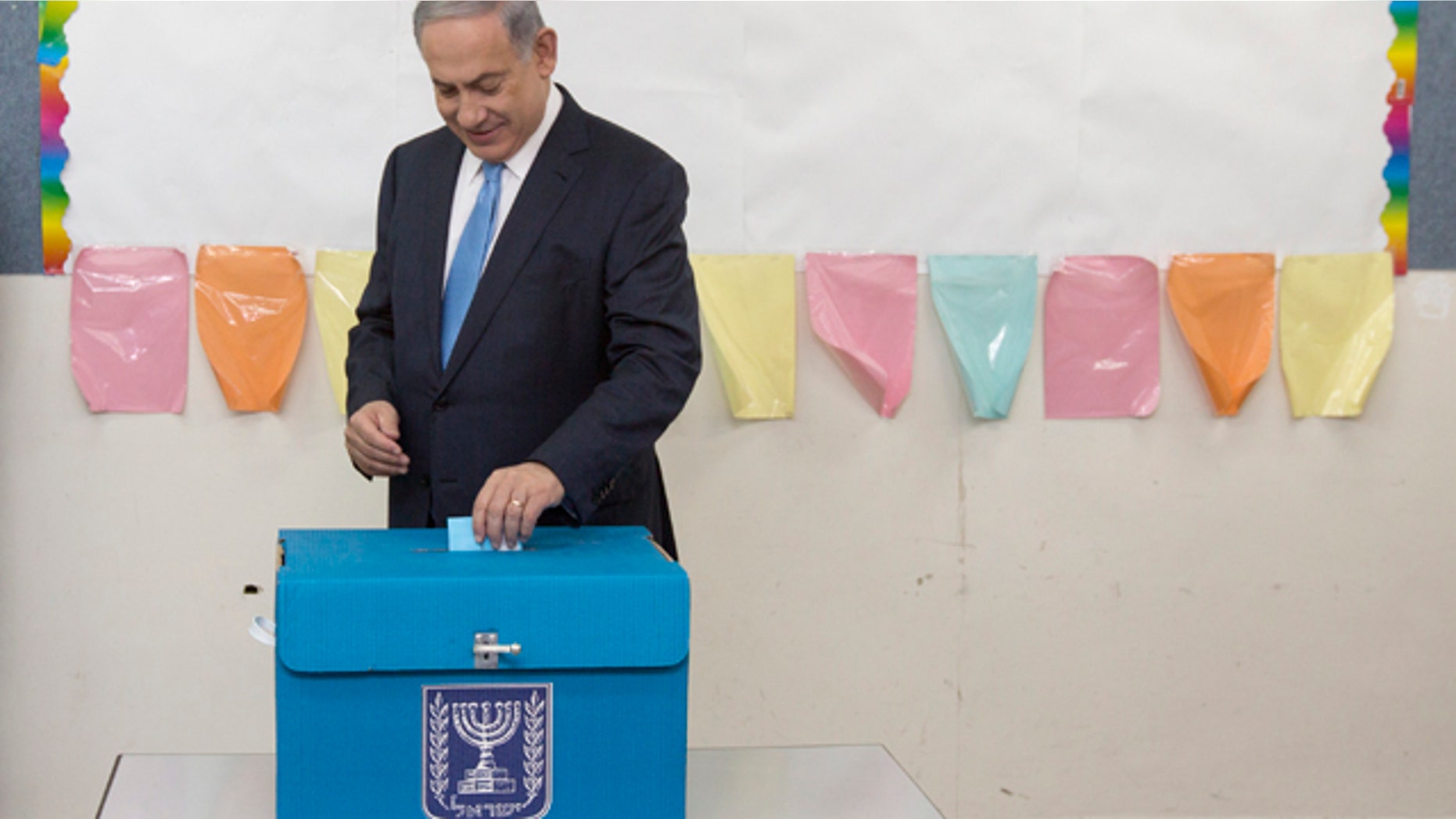 March 17, 2015: Israeli Prime Minister Benjamin Netanyahu casts his vote during Israel's parliamentary elections in Jerusalem. (AP Photo/Sebastian Scheiner, Pool)