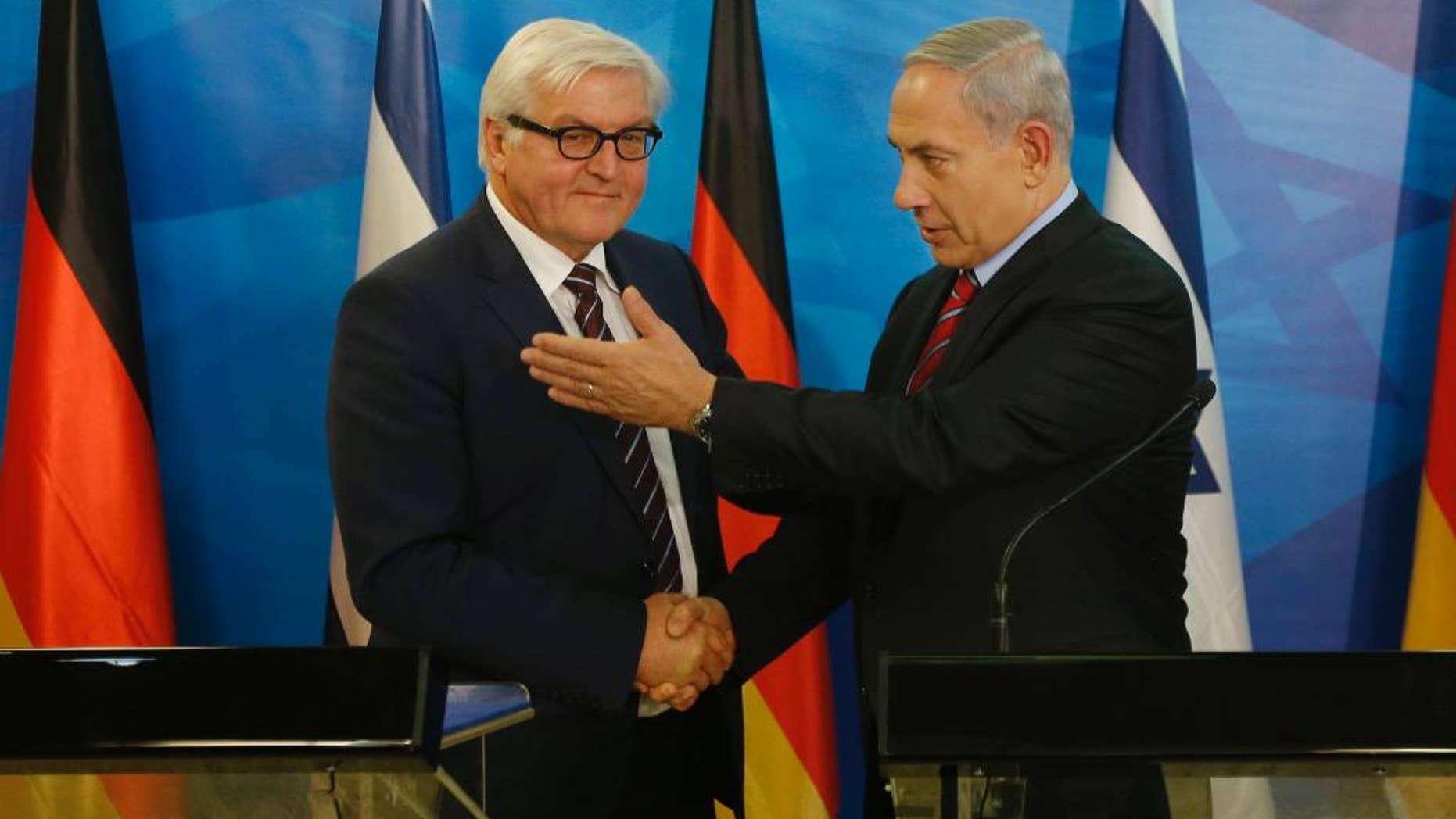 Israel's Prime Minister Benjamin Netanyahu, right, shakes hands with Germany's Foreign Minister Frank-Walter Steinmeier during their meeting in Jerusalem on Sunday, Nov. 16, 2014. (AP Photo/Ronen Zvulun, Pool)