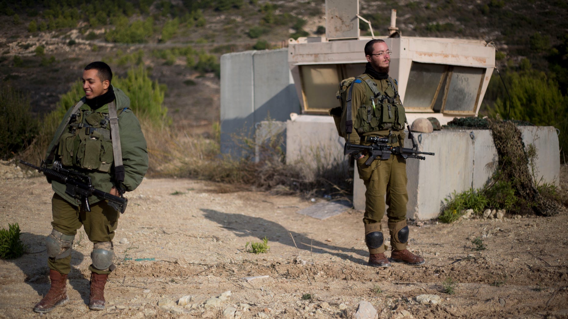Dec. 16, 2013 - Israeli soldiers stand guard in Rosh Hanikra, Israel, near the border between northern Israel and Lebanon. Israeli troops shot two Lebanese soldiers early Monday, hours after a Lebanese army sniper killed an Israeli soldier as he drove along the volatile border late at night, the Israeli military said. The shootings raised the possibility of renewed fighting in the area, which has remained mostly quiet since a month-long war in 2006.