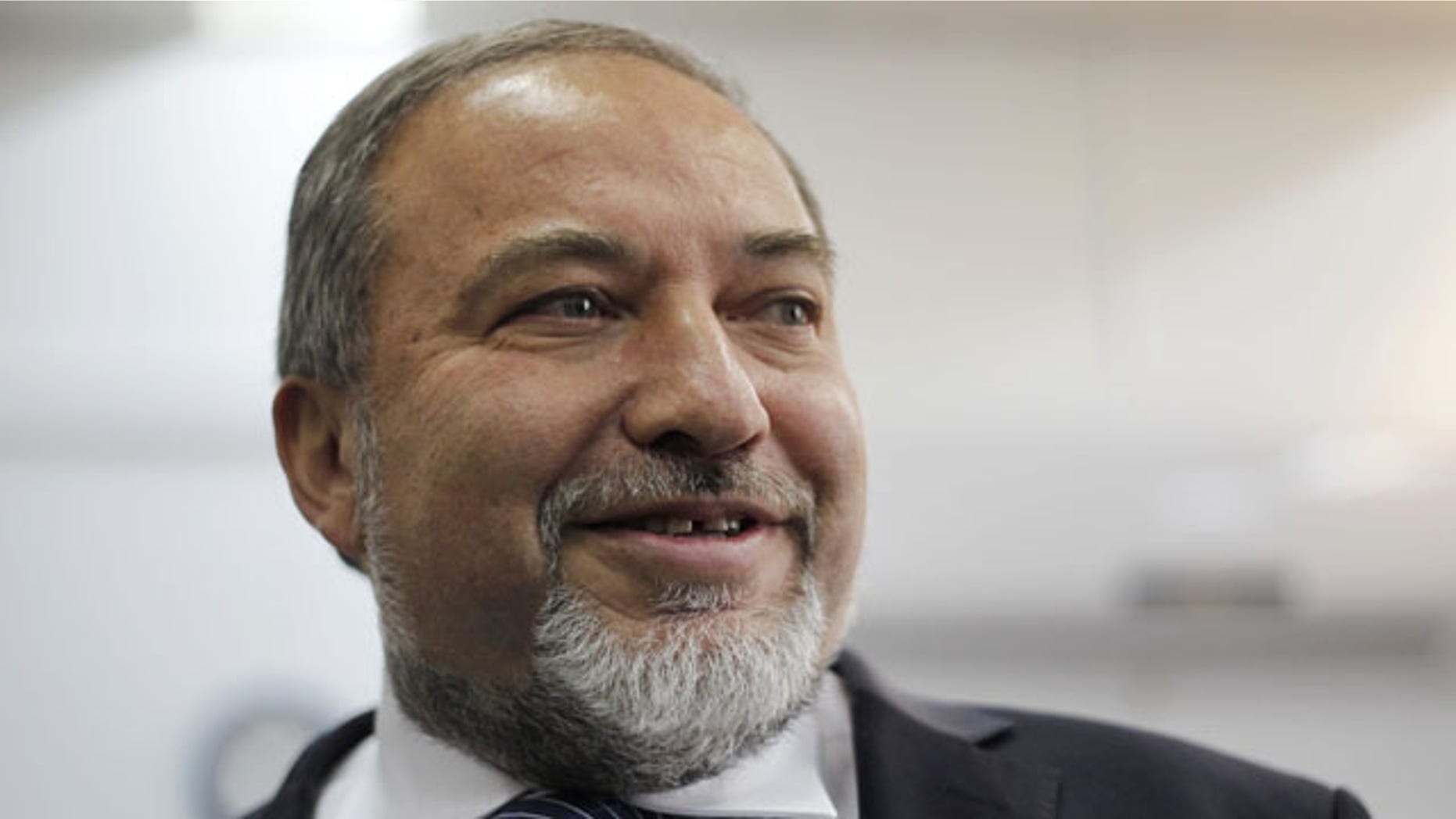 FILE - In this Sunday, Feb. 17, 2013 file photo, Israel's hard-line former Foreign Minister Avigdor Lieberman arrives at a Jerusalem court for the opening hearing of his trial on charges of fraud and breach of trust. (AP Photo)