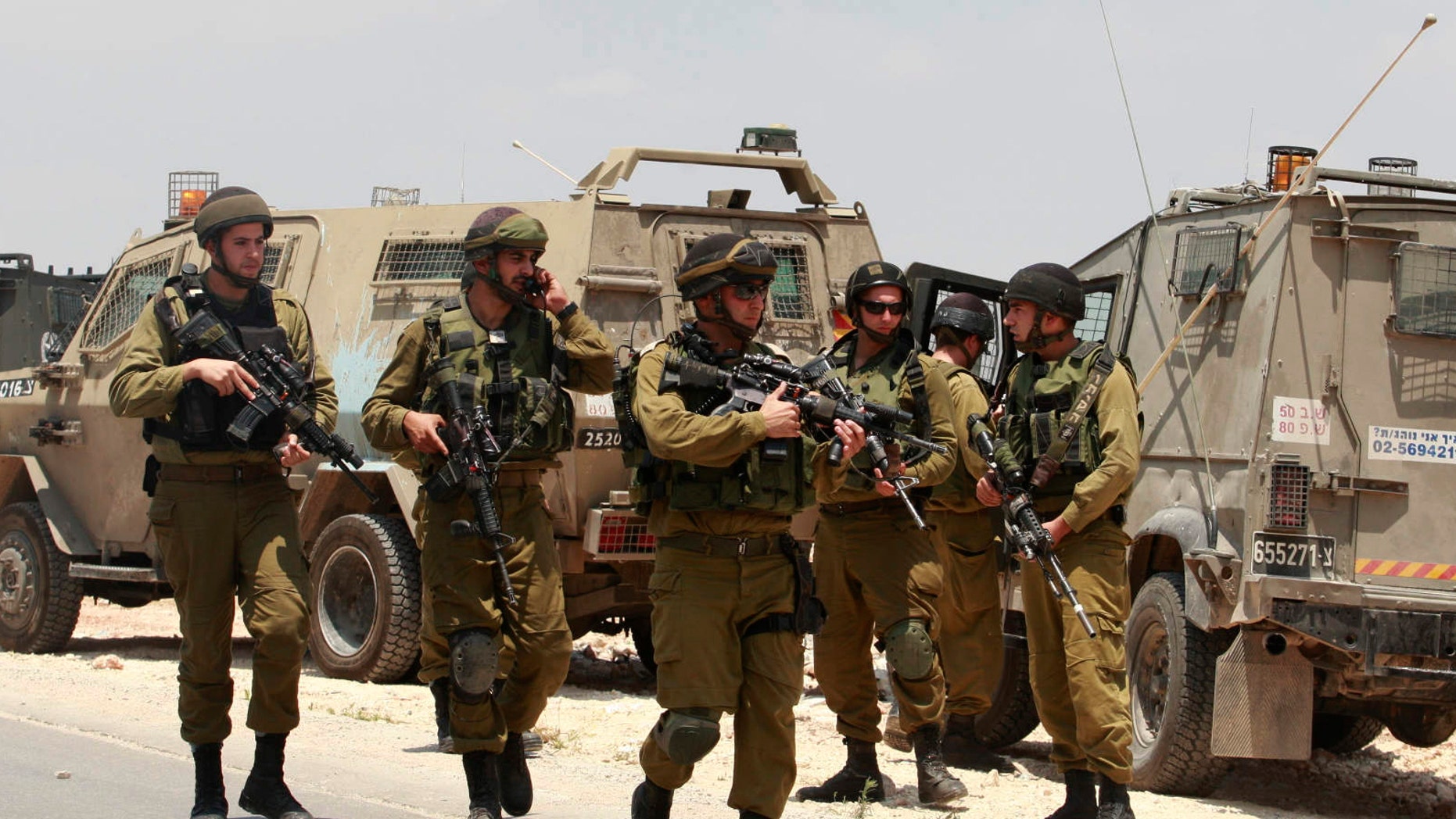 June 13, 2014 - Israeli soldiers deploy near the West Bank city of Hebron. Israeli soldiers searched the West Bank on Friday for 3 missing teens from nearby settlements, one of them a U.S. citizen, amid fears Palestinian militants abducted them, authorities said.