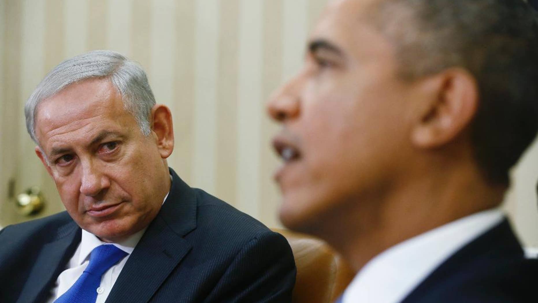 FILE - In this Sept. 30, 2013 file photo, President Barack Obama meets with Israeli Prime Minister Benjamin Netanyahu in the Oval Office at the White House in Washington. Despite Netanyahu's speech to Congress, his efforts to halt the Iranian nuclear program which he describes as the mission of his lifetime appear to be stumbling as the U.S. seems to move toward a deal with the Islamic Republic. (AP Photo/Charles Dharapak, File)