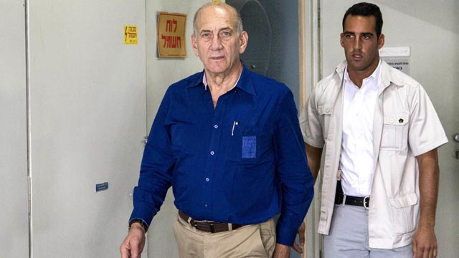 May 13, 2014: Israel's former Prime Minister Ehud Olmert arrives for his trial at the Tel Aviv District Court. (AP Photo/Jack Guez, Pool)