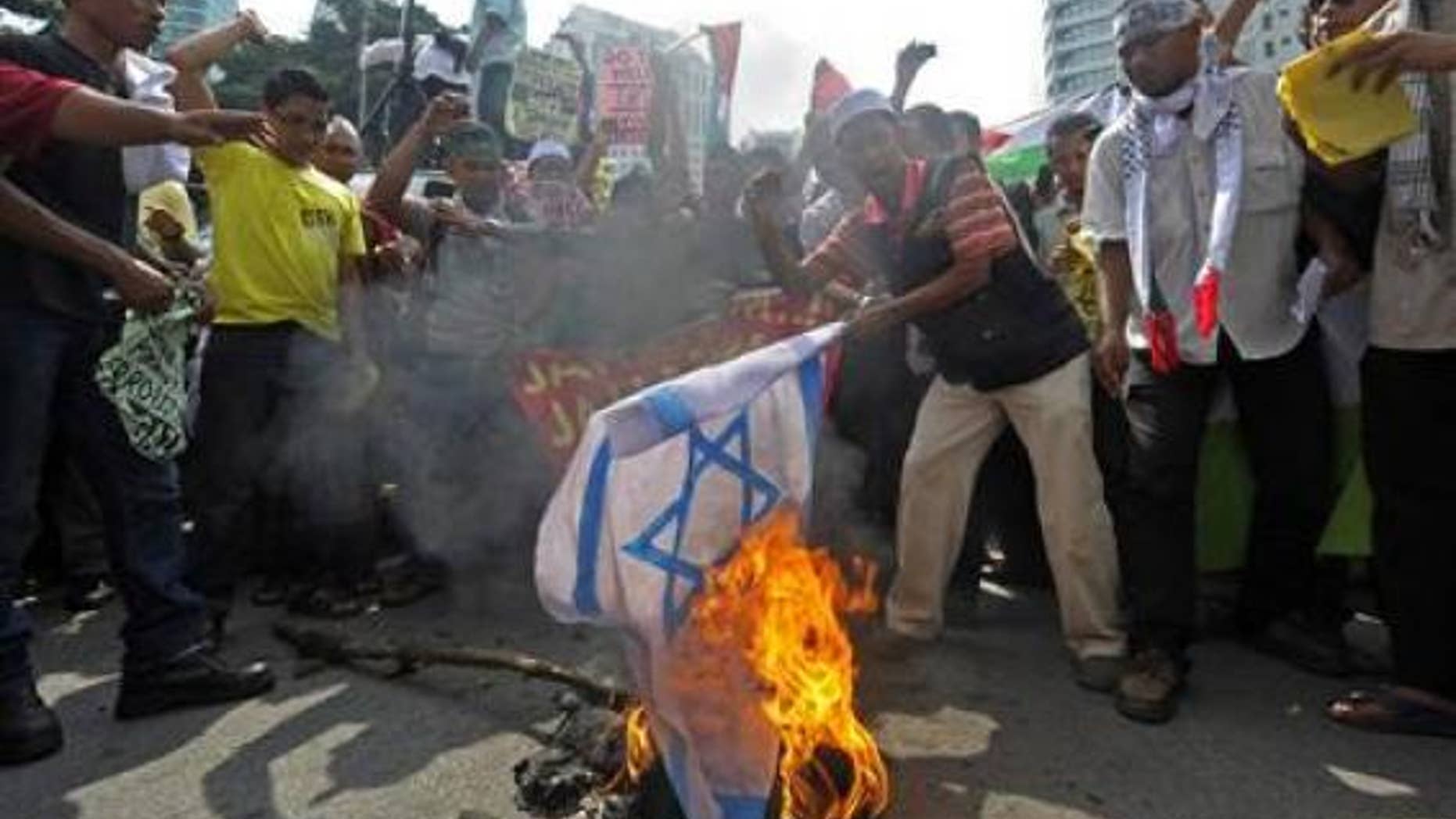 Friday: In Malaysia, a demonstrator set fire to an Israeli national flag near the U.S. embassy to protest Israel's raid of a Gaza-bound flotilla.