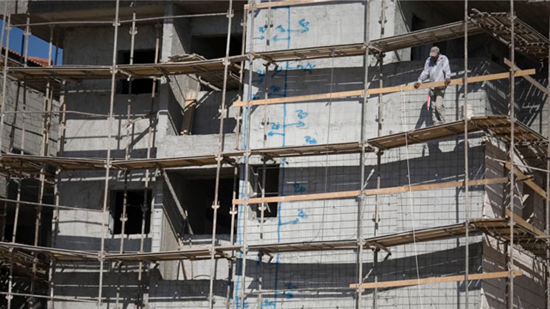 Nov. 9: A construction worker looks on at a site in the West Bank Jewish settlement of Ariel. The official Palestinian news agency said the Palestinian president wants a U.N. Security Council session to discuss such Israeli settlement construction.