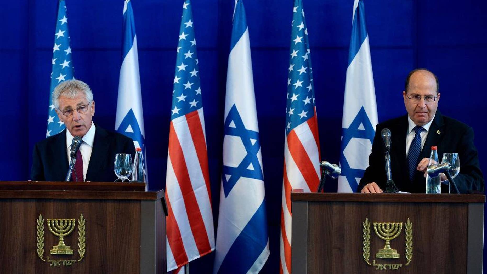 U.S. Defense Secretary Chuck Hagel, left, and Israel's Defense Minister Moshe Yaalon, right, speak during a joint conference following a meeting at Israel's Defense Force headquarters in Tel Aviv, Thursday, May 15, 2014. Hagel is on a regional tour focusing on Iran's nuclear program and Syria's civil war. (AP Photo/Mandel Ngan, Pool)