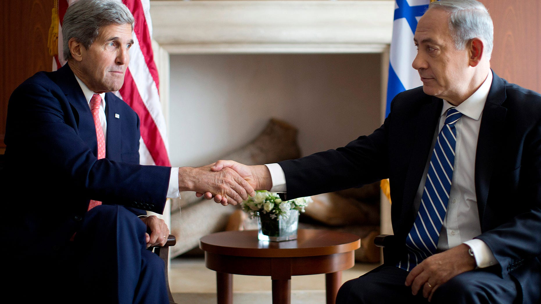 U.S. Secretary of State John Kerry, right, shakes hands with Israeli Prime Minister Benjamin Netanyahu in Jerusalem, Wednesday, Nov. 6, 2013. (AP Photo/Jason Reed, Pool)