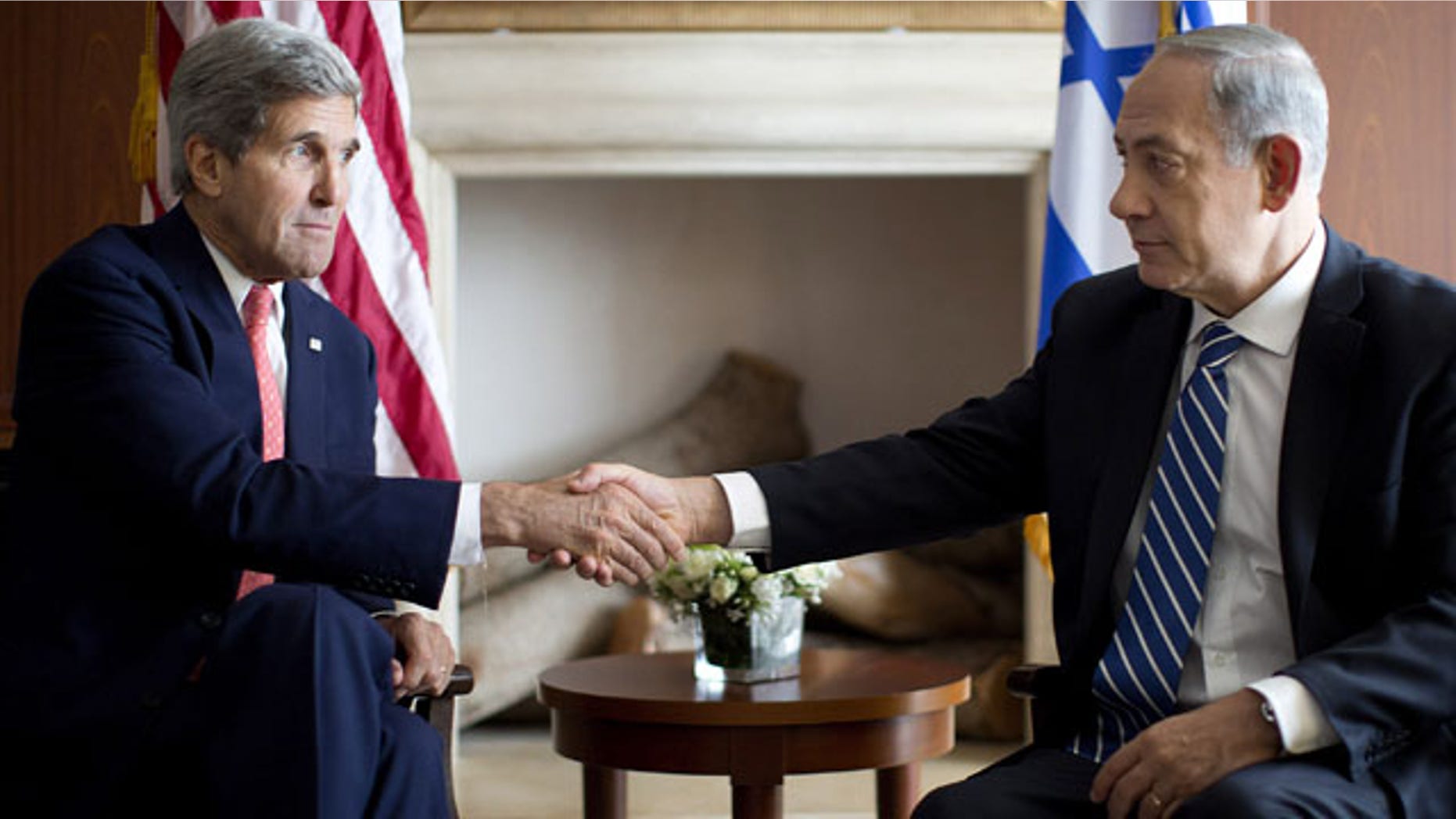 November 6, 2013: U.S. Secretary of State John Kerry, right, shakes hands with Israeli Prime Minister Benjamin Netanyahu in Jerusalem, Wednesday, Nov. 6, 2013. (AP Photo/Jason Reed, Pool)
