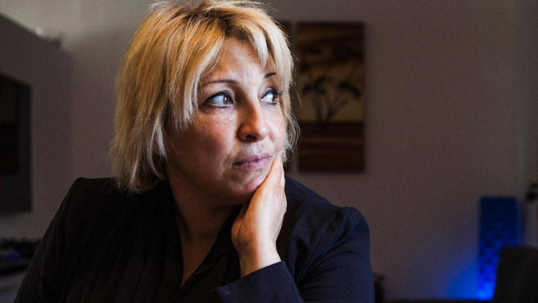 This photo taken on Tuesday, Dec. 30, 2014 shows Anett Haskia at her house at Kinbutz Yehiam next to the city of Nahariyah, Israel. Haskia is breaking every possible stereotype by running for a parliament seat with a pro-settler, religious Jewish party opposed to a Palestinian state. (AP Photo/Dan Balilty)