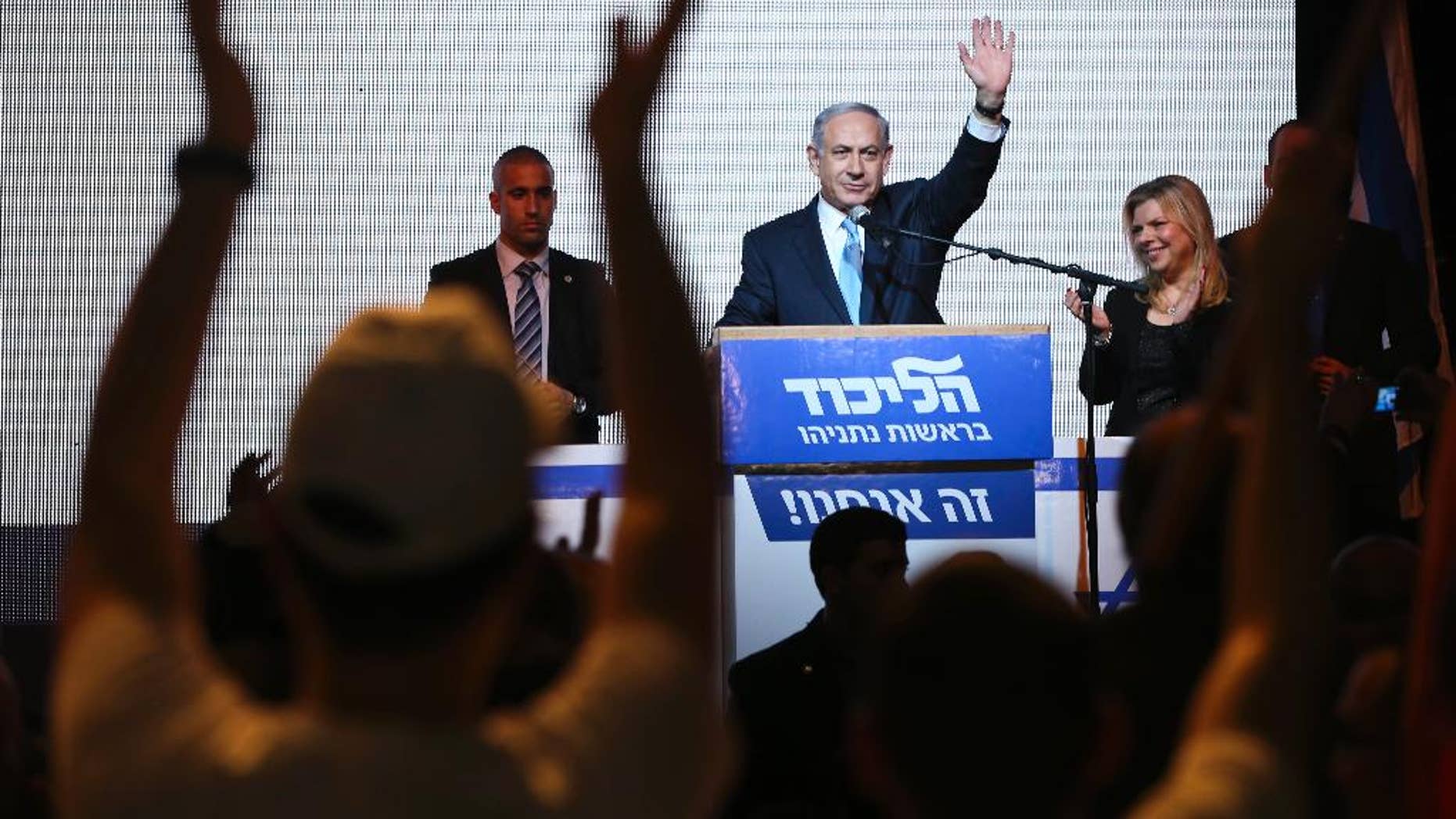 FILE - In this March 17, 2015 file photo, Israeli Prime Minister Benjamin Netanyahu greets supporters at the party's election headquarters in Tel Aviv, Israel. Netanyahu's Likud won 30 seats in the 120-seat parliament, and parties apparently willing to back him won another 37 for a possible majority. The reasons for that outcome go beyond the party's nationalist ideology and include Israel's sense of geographic vulnerability, its fragmented politics and a master campaigner in Netanyahu himself. (AP Photo/Oded Balilty, File)