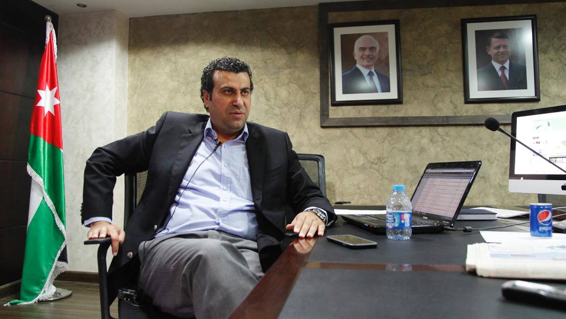 In this Wednesday, June 10, 2015 photo, Abdullah Sawalha, director of the Center for Israel Studies, talks about the motives and structure of the new research center focused on increasing Arab understanding of Israel in Amman, Jordan. The center began operations, setting up a website this year that publishes Arabic translations of Israeli articles about Israel and its views of the Arab world. Sawalha said he is trying to provide more accurate information about Israel, arguing that Jordanians know little or have been misinformed. (AP Photo/Sam McNeil)