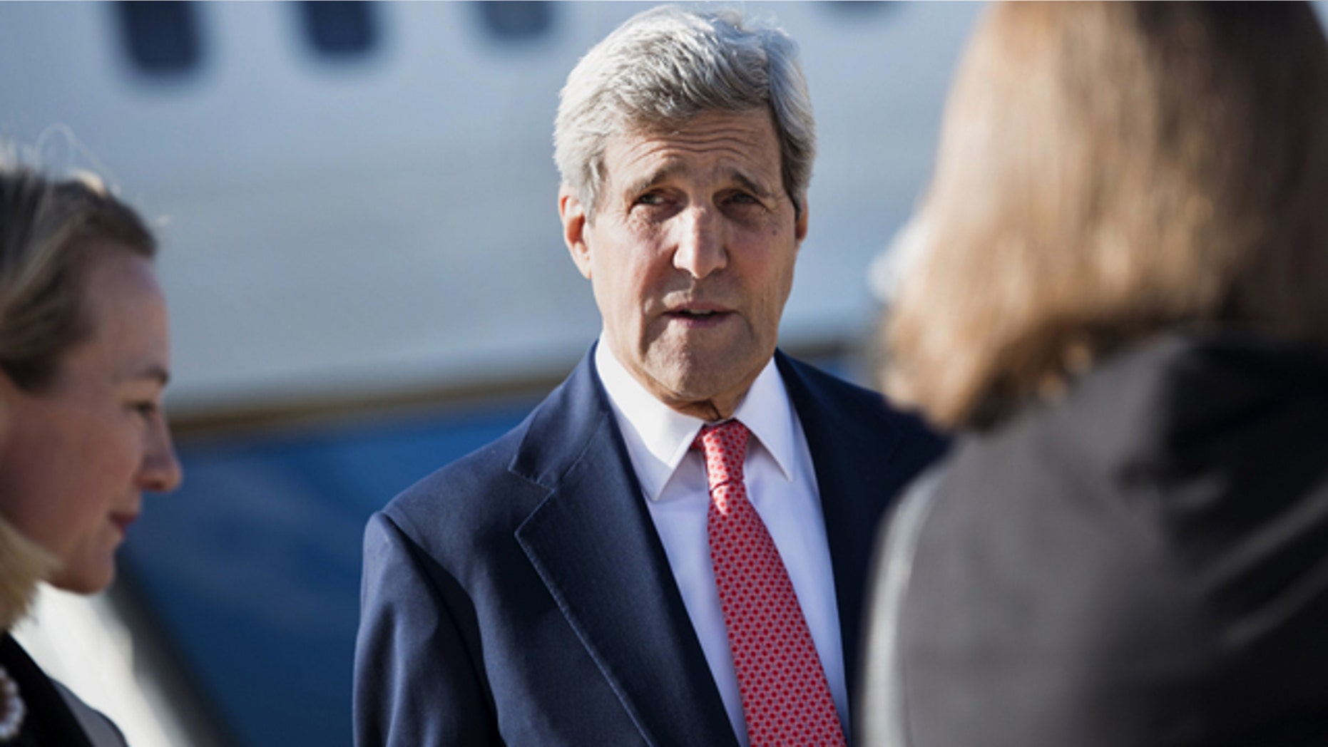 September 10, 2014: U.S. Secretary of State John Kerry arrives at Queen Alia Airport in Amman, Jordan. (AP Photo/Brendan Smialowski, Pool)