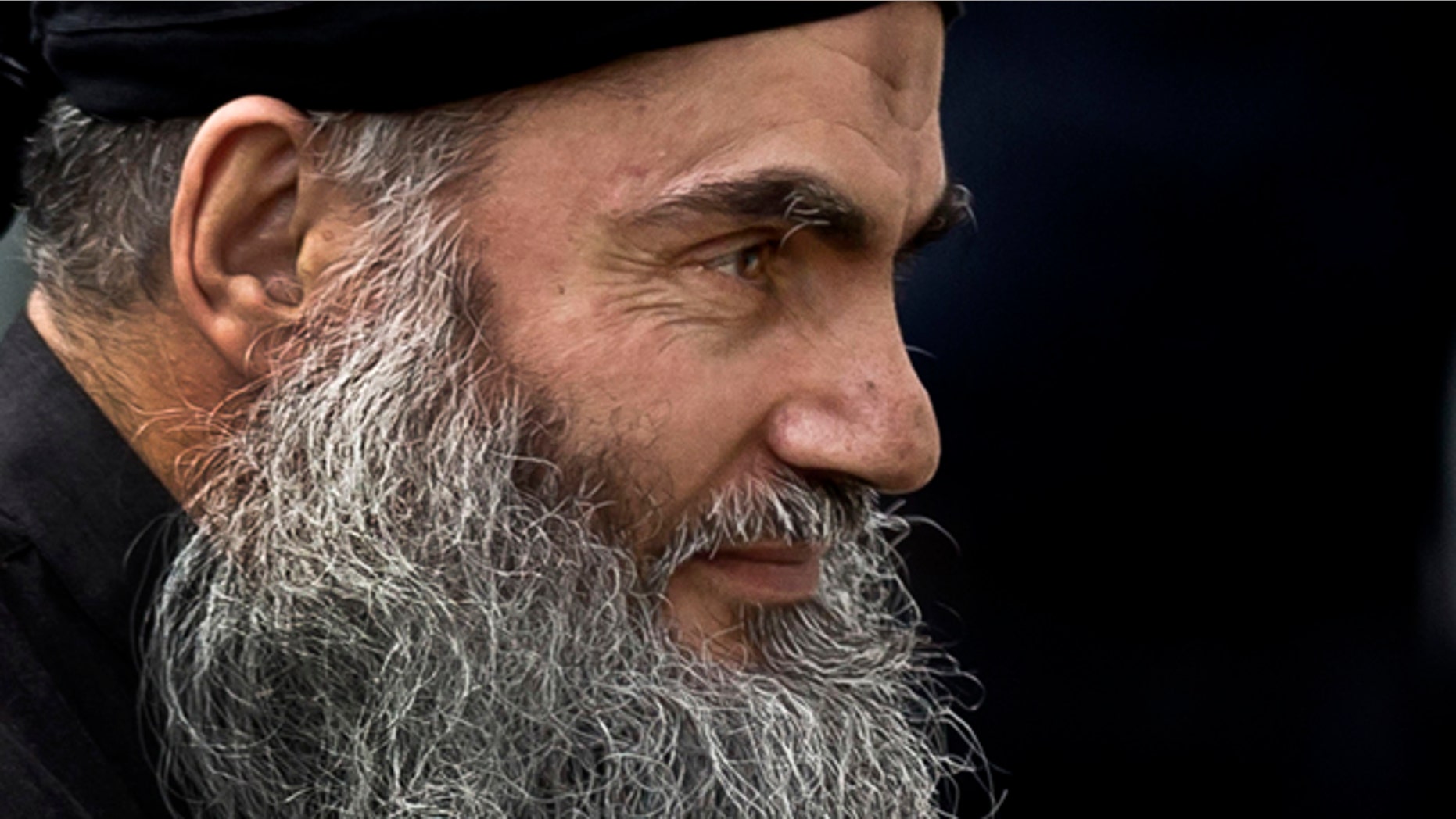 FILE - November 12, 2013: Radical Al Qaeda-linked preacher Abu Qatada arrives back to his residence in London after being freed from prison. A Jordanian military court has acquitted Abu Qatada of terror charges over a foiled 1999 plot to attack an American school in the Jordanian capital, Amman. (AP Photo/Matt Dunham, File)